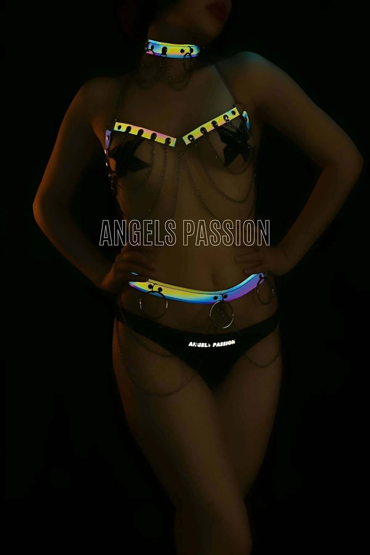 Reflective rainbow choker with riveted edges showing iridescent color shift under light