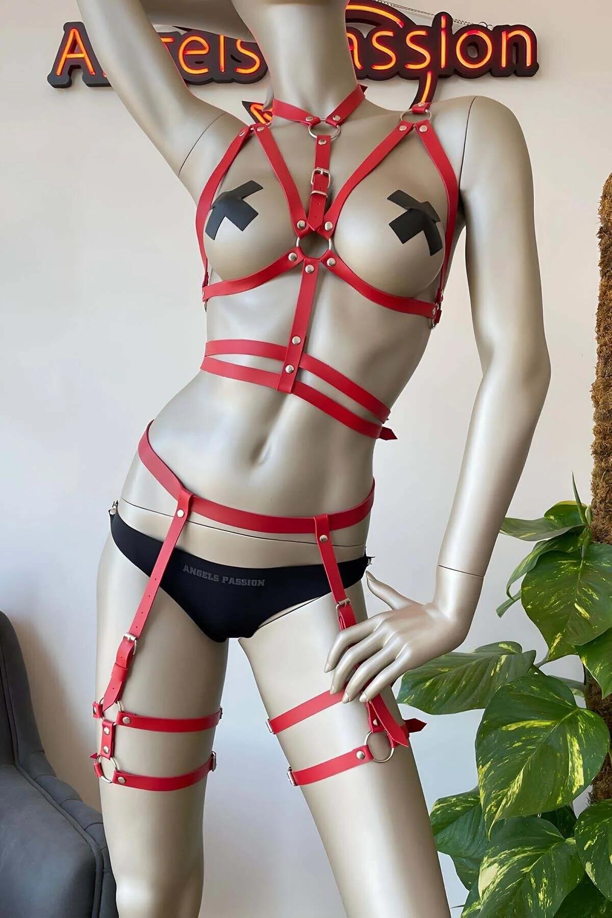 Red faux leather full body harness with chest cage straps, waist bands, and thigh garter wraps with silver O-rings
