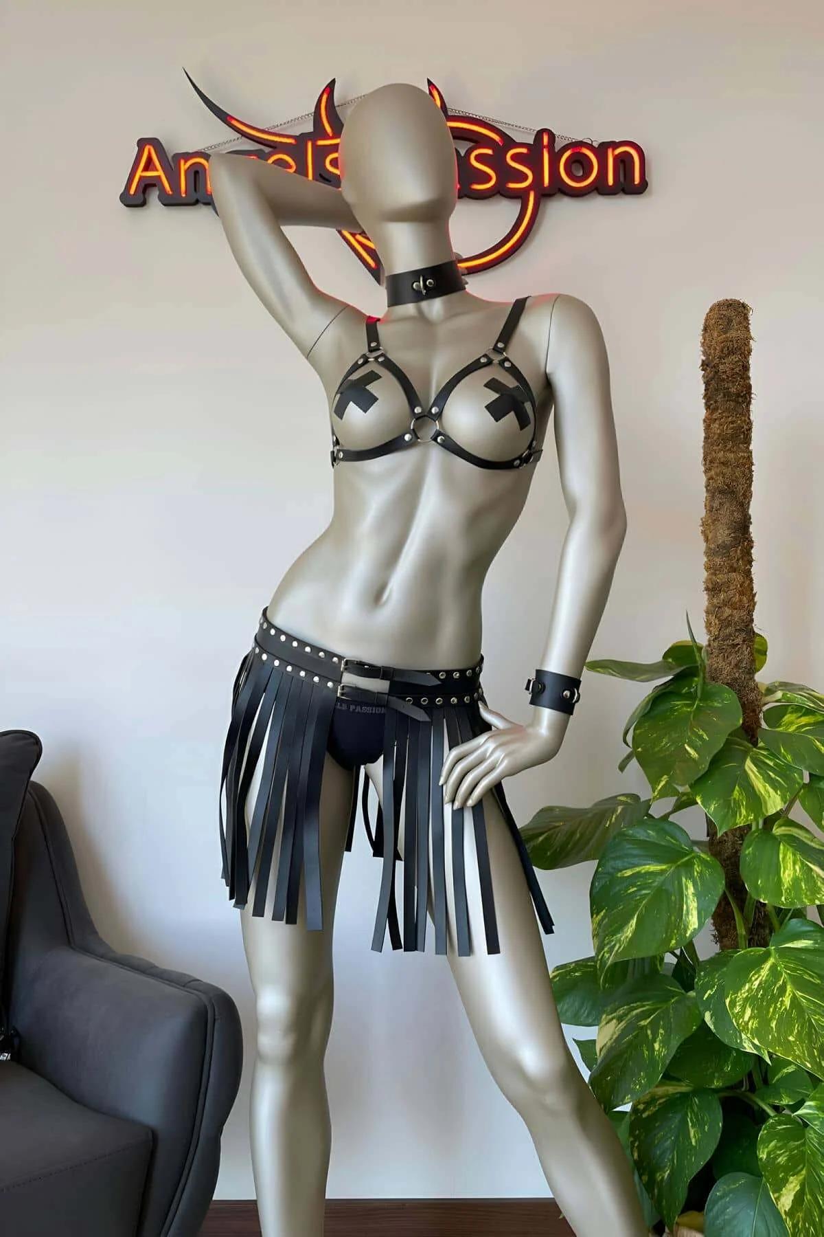 Full-length view of black faux leather fringe skirt showing 30 cm fringe movement
