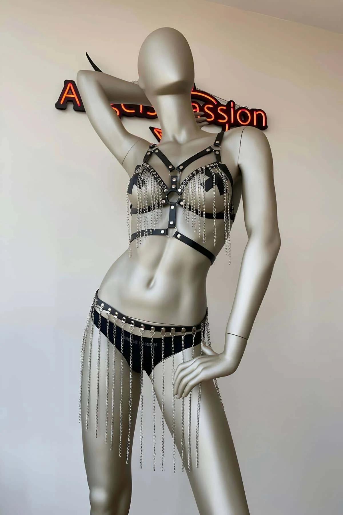 Two-piece black faux leather harness set — hip belt with silver flat-link chain drape, side angle