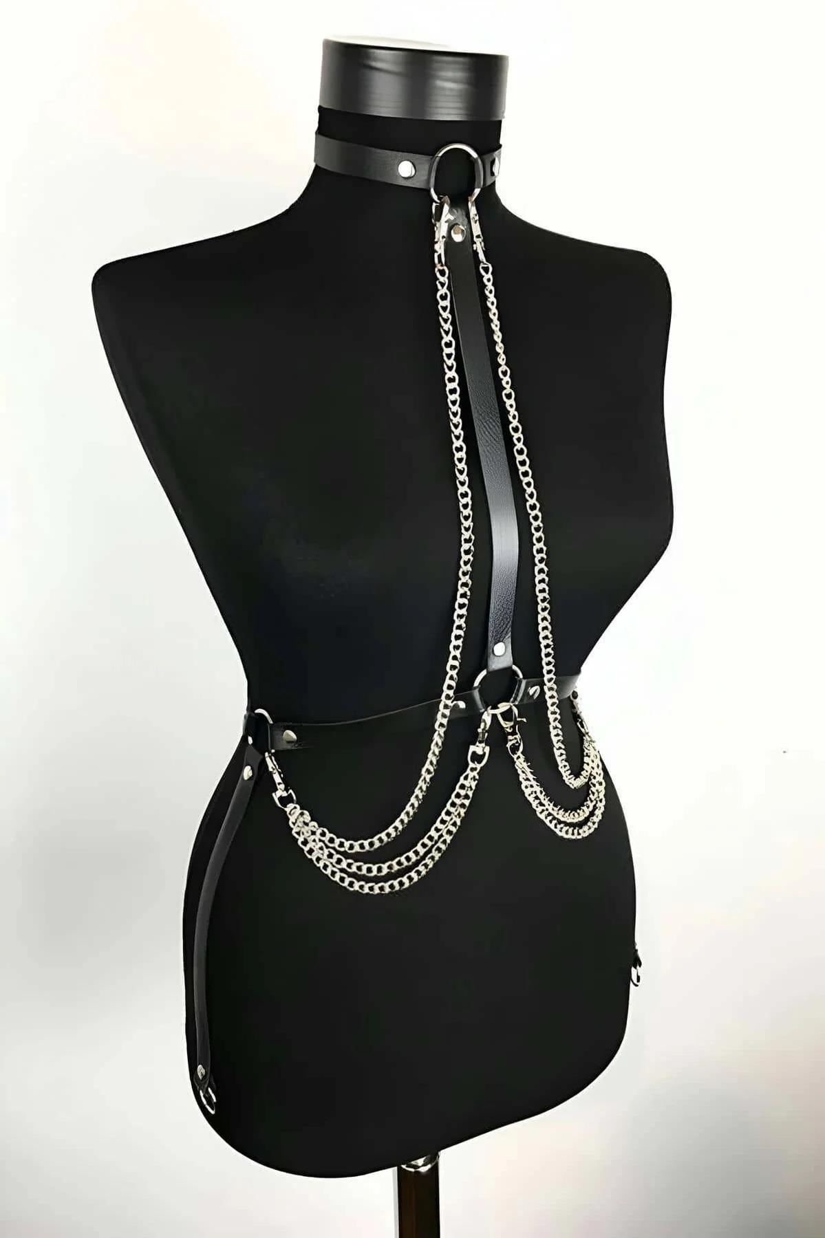 Close-up of silver O-ring and rivet studs on black faux leather choker band