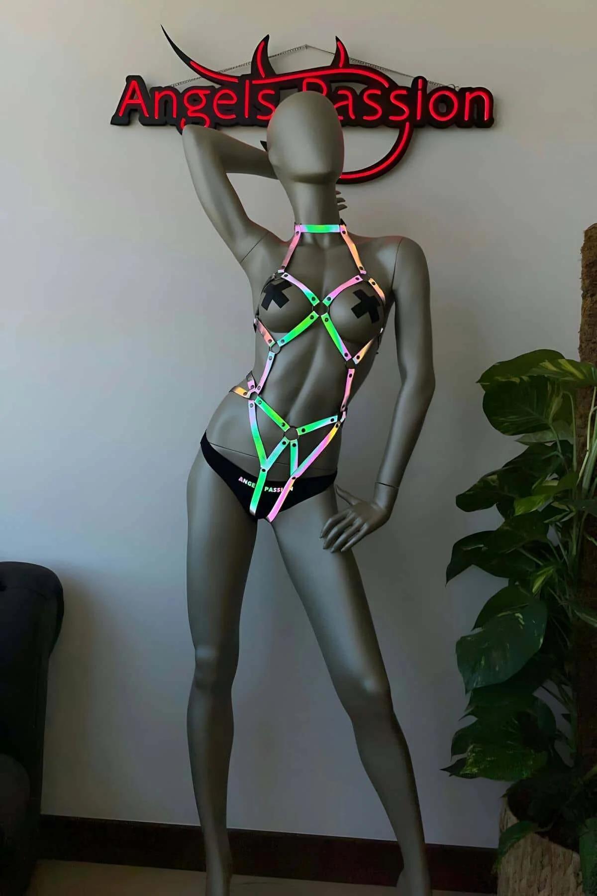 Silver-tone metal snap closures on iridescent full body harness hip band detail