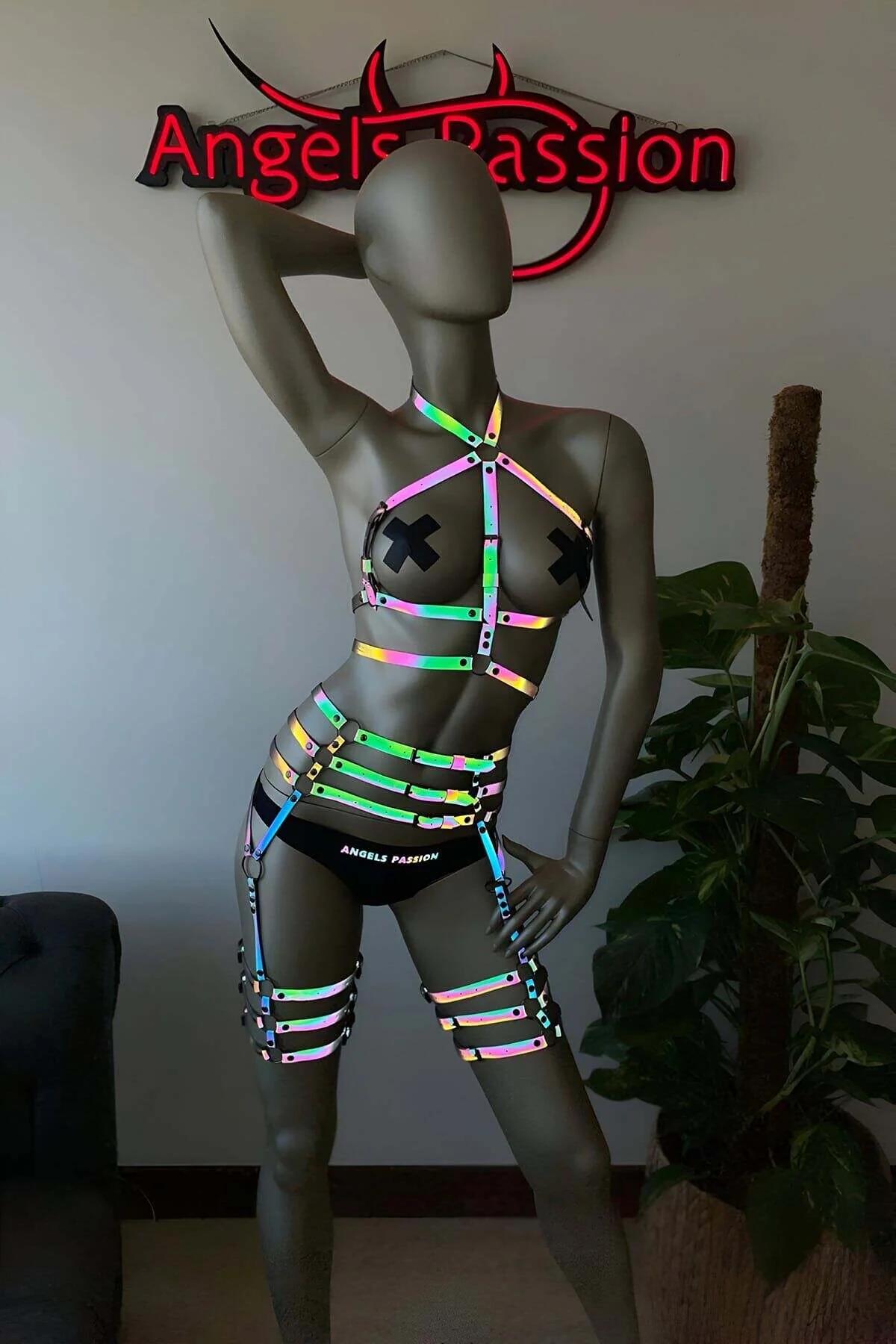 Chrome snap buckles and rivets on holographic rainbow strap harness waist section close-up