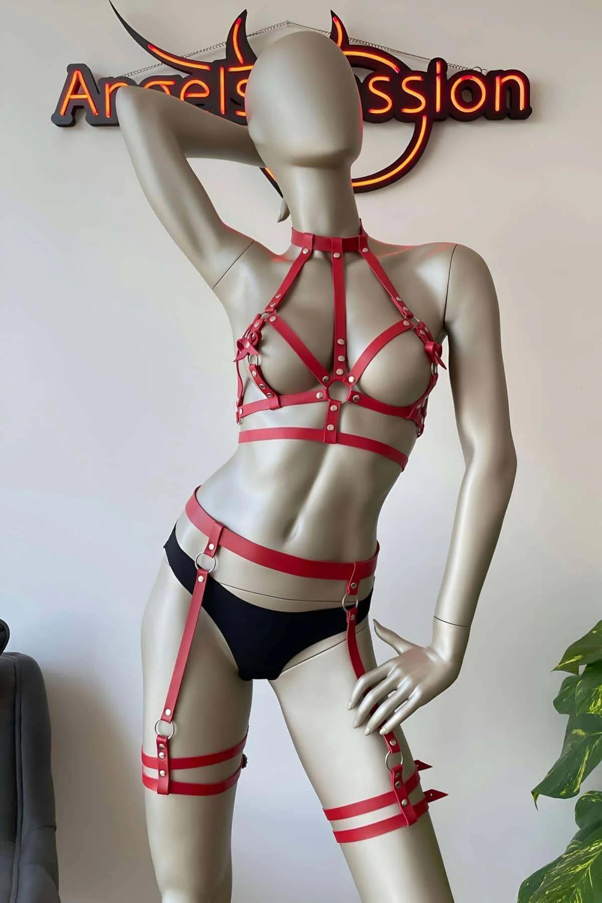 Red PU leather midriff harness with three horizontal bands and silver buckles, close-up back view