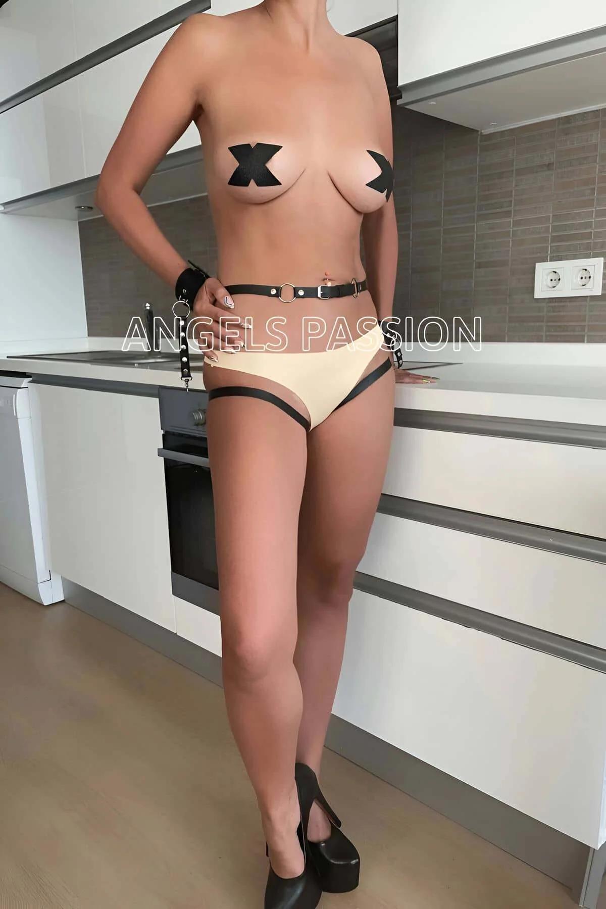 Adjustable garter straps with silver O-rings extending from waistband to mid-thigh, rear view