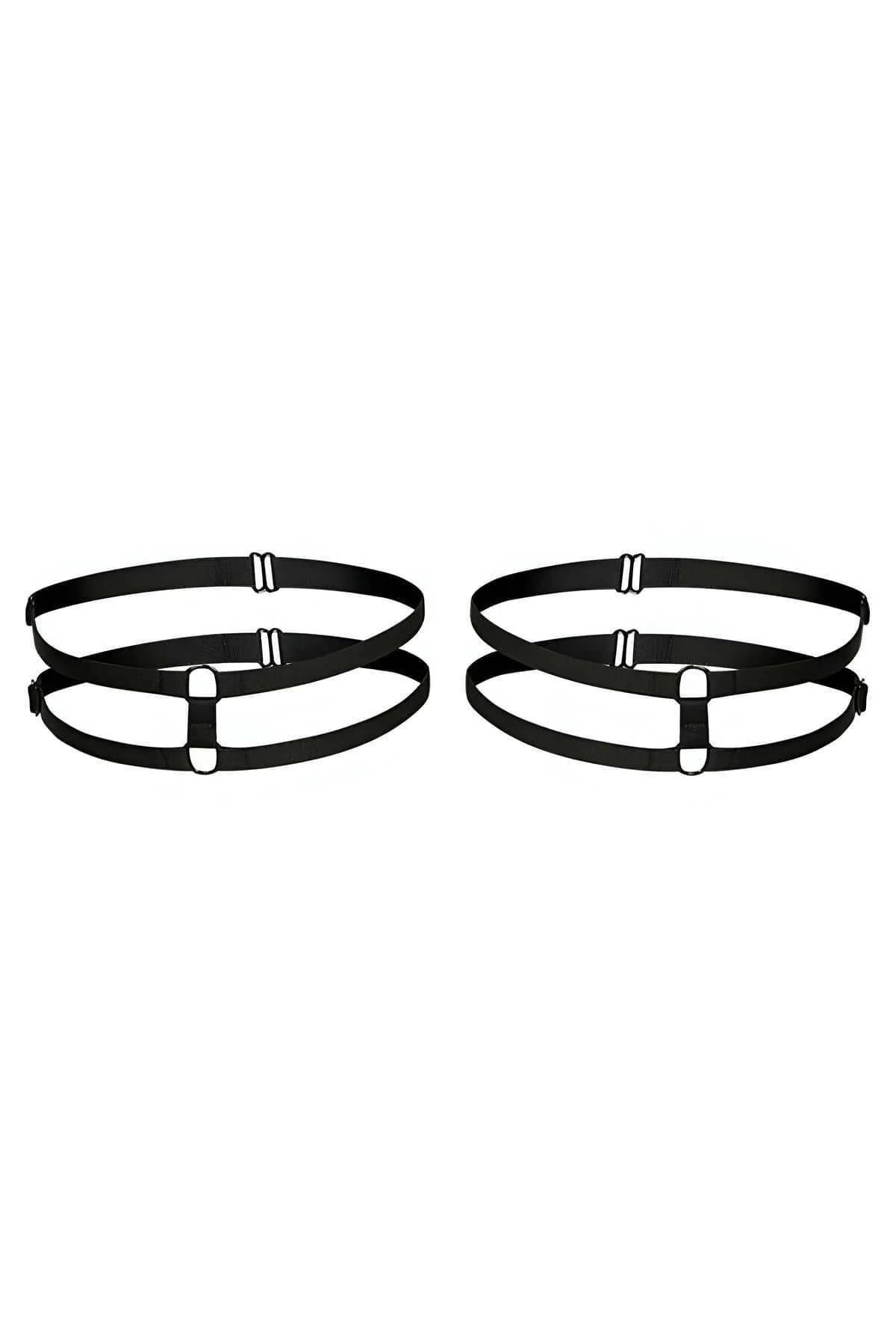 Close-up of black faux leather choker harness with gold-tone O-ring at center chest