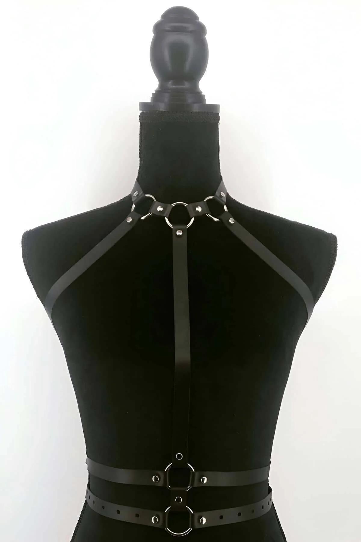 Back view of black vegan leather collar harness showing snap closure and strap width