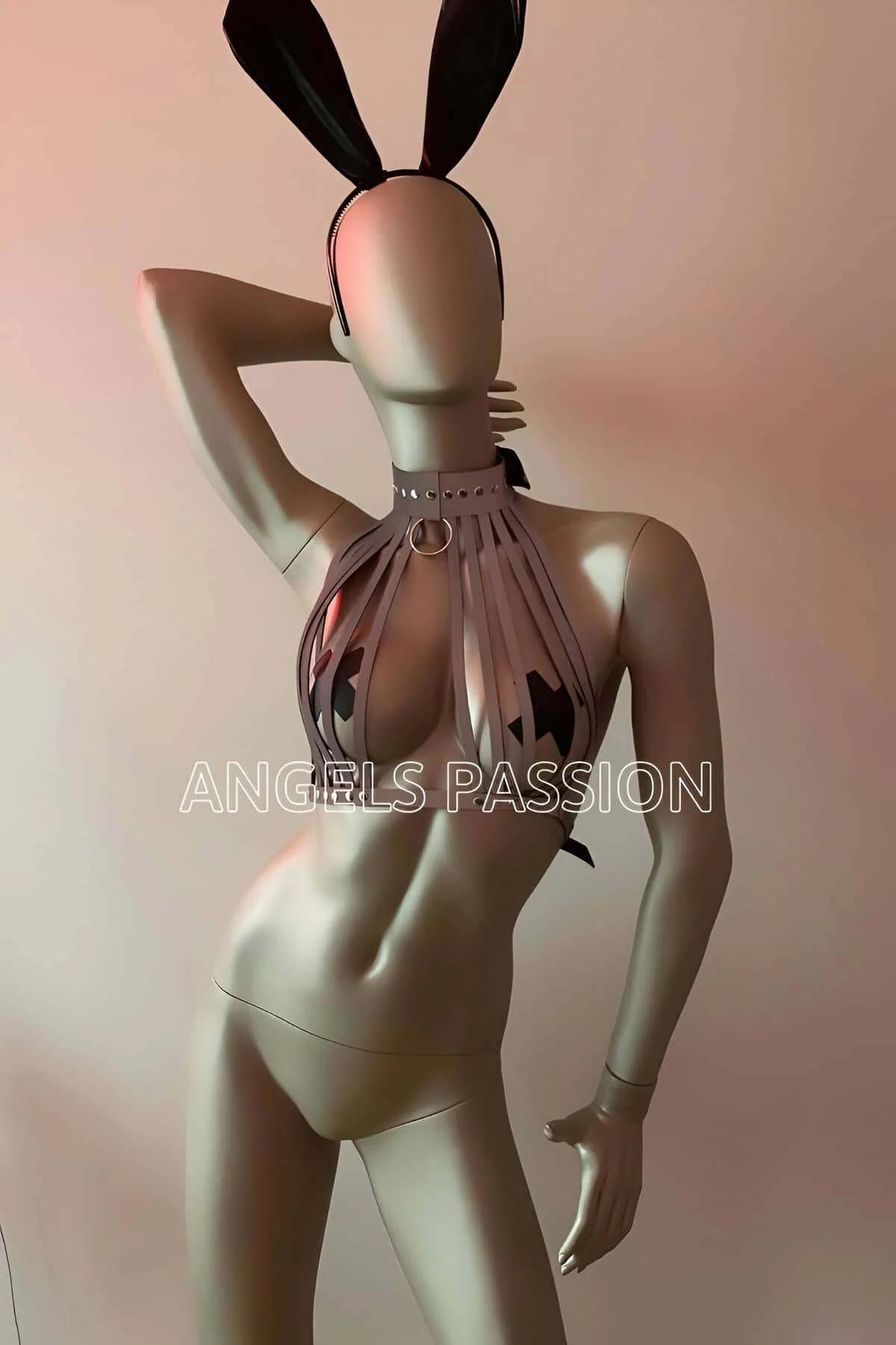 Front view of silver reflective bib cage top showing vertical strap spacing and open midriff detail