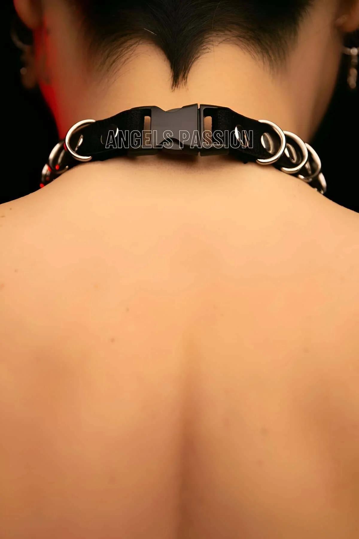 Back view of black faux leather choker with silver chain band and adjustable closure