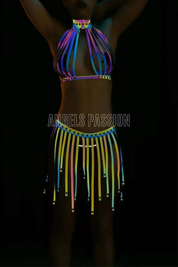 Multi-color reflective halter top and tassel skirt set glowing neon rainbow under UV blacklight with rivet hardware