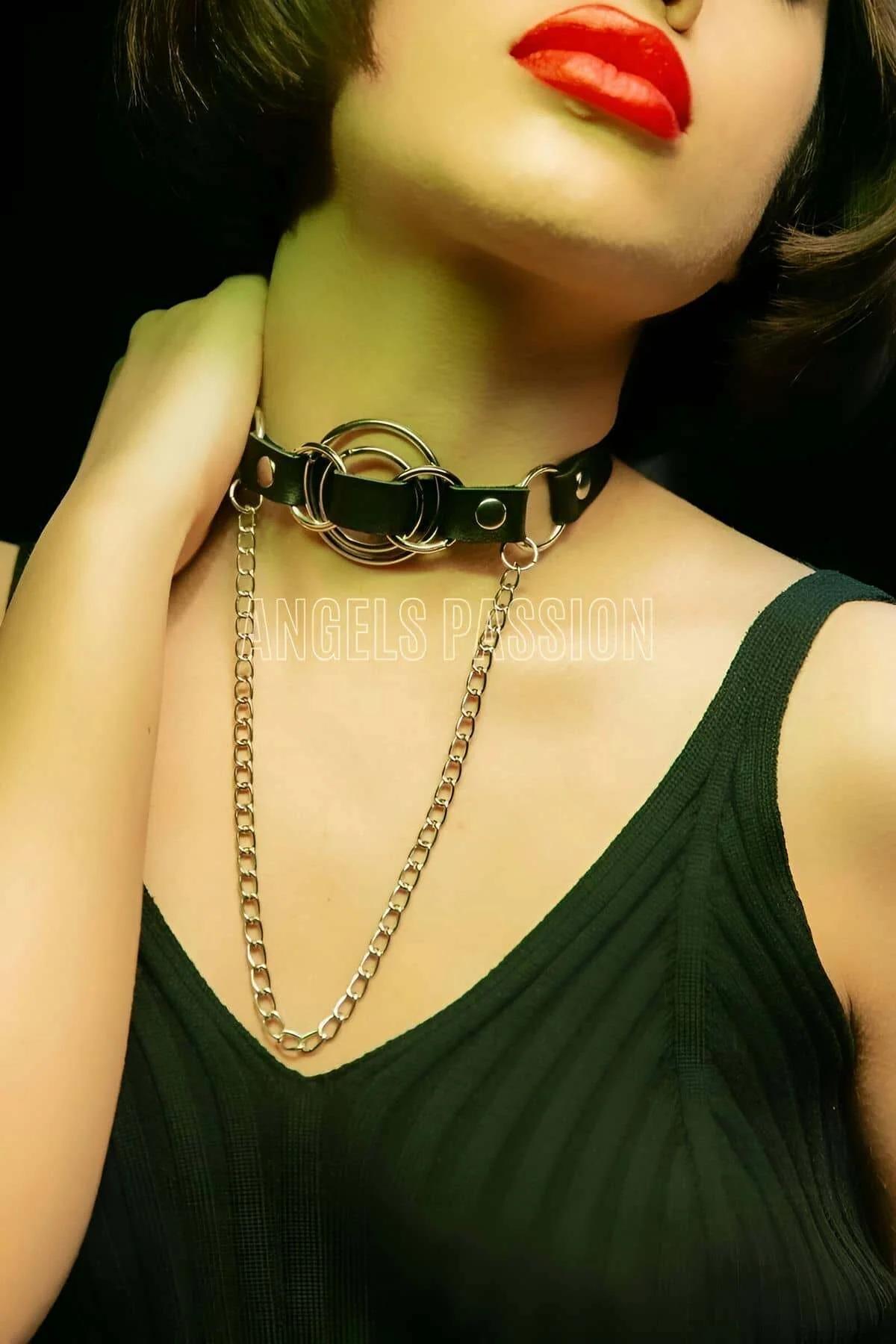 Close-up of triple silver O-ring cluster on black PU leather choker band
