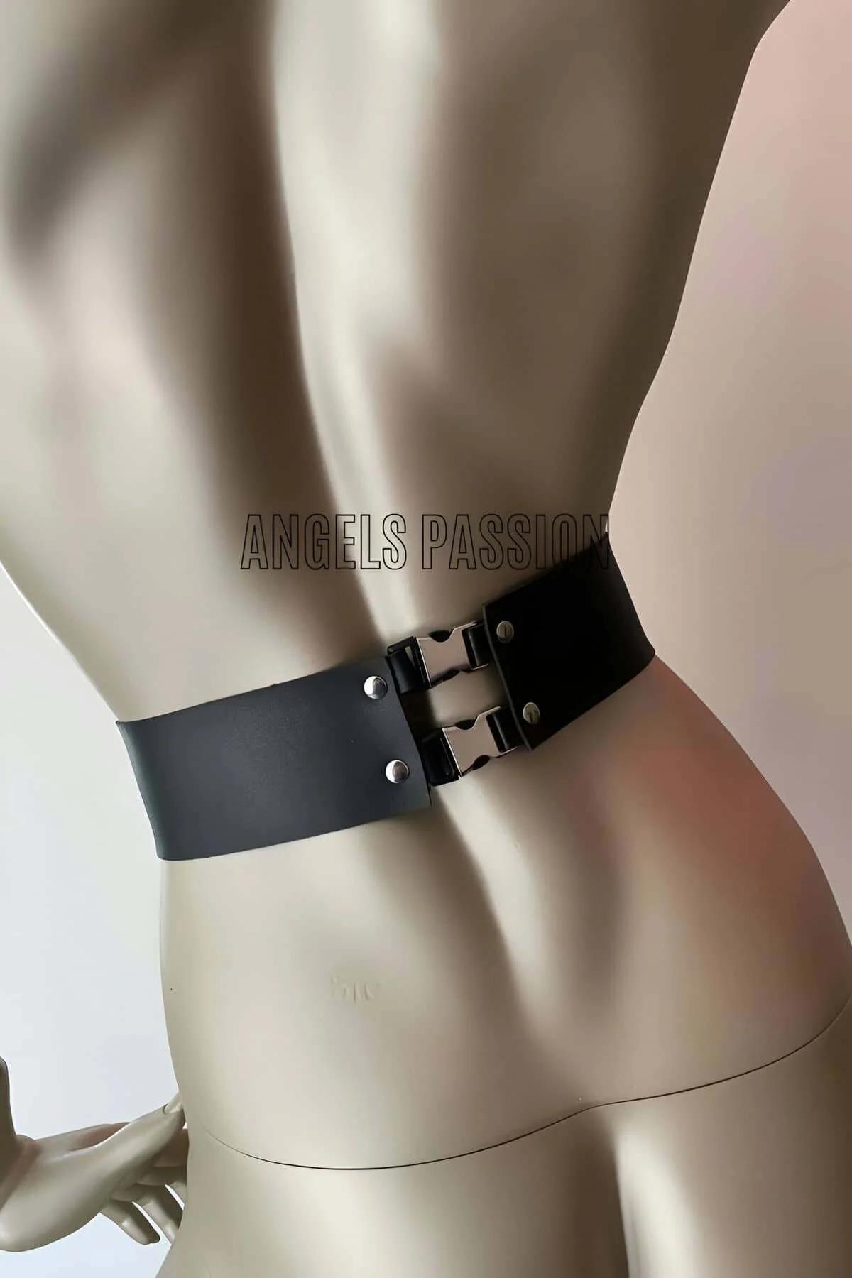 Black body harness chest straps with silver O-ring connector at collar bone, front view