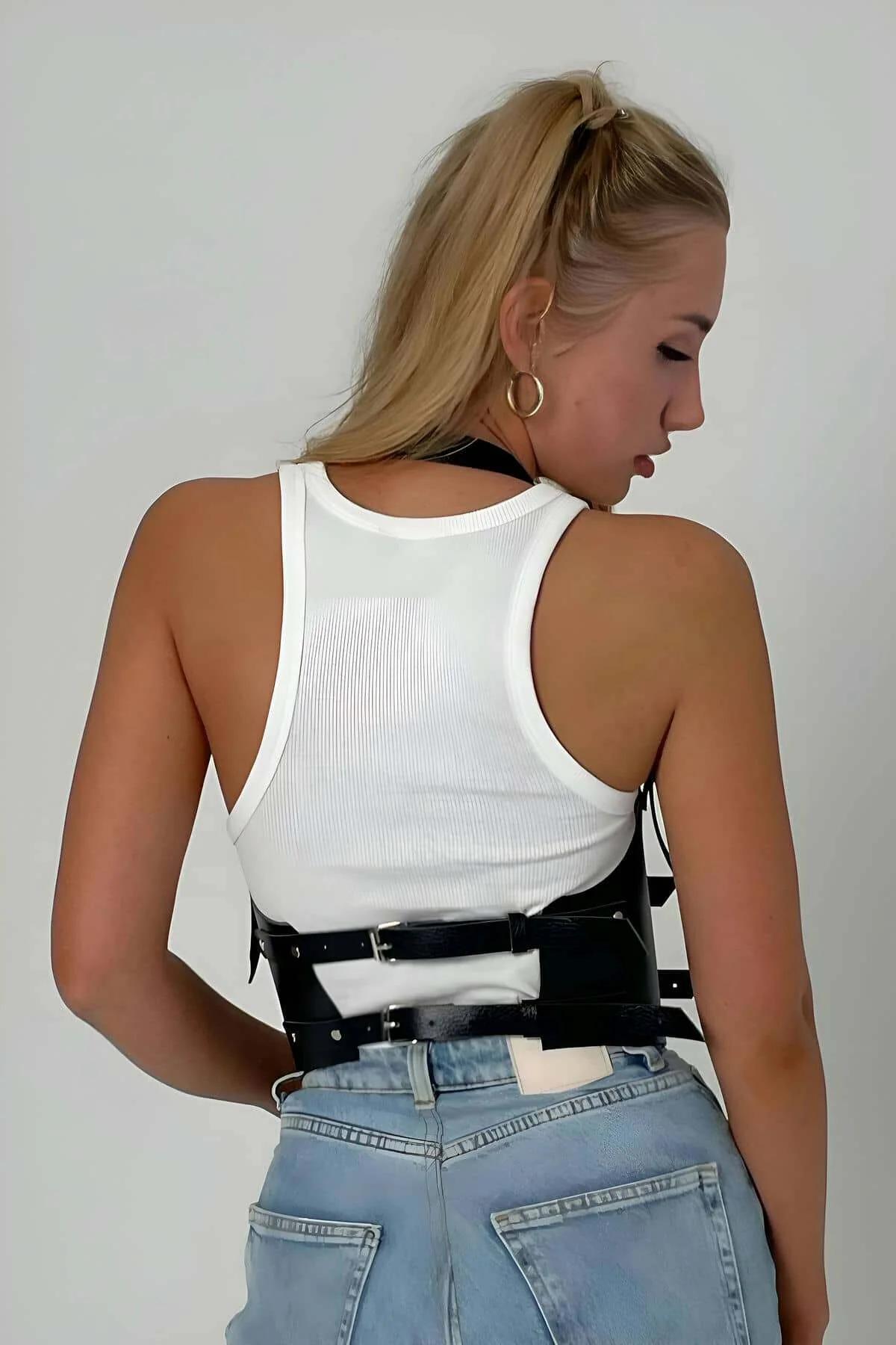 Front view of black faux leather corset harness showing two silver-tone metal buckle closures on wide waistband