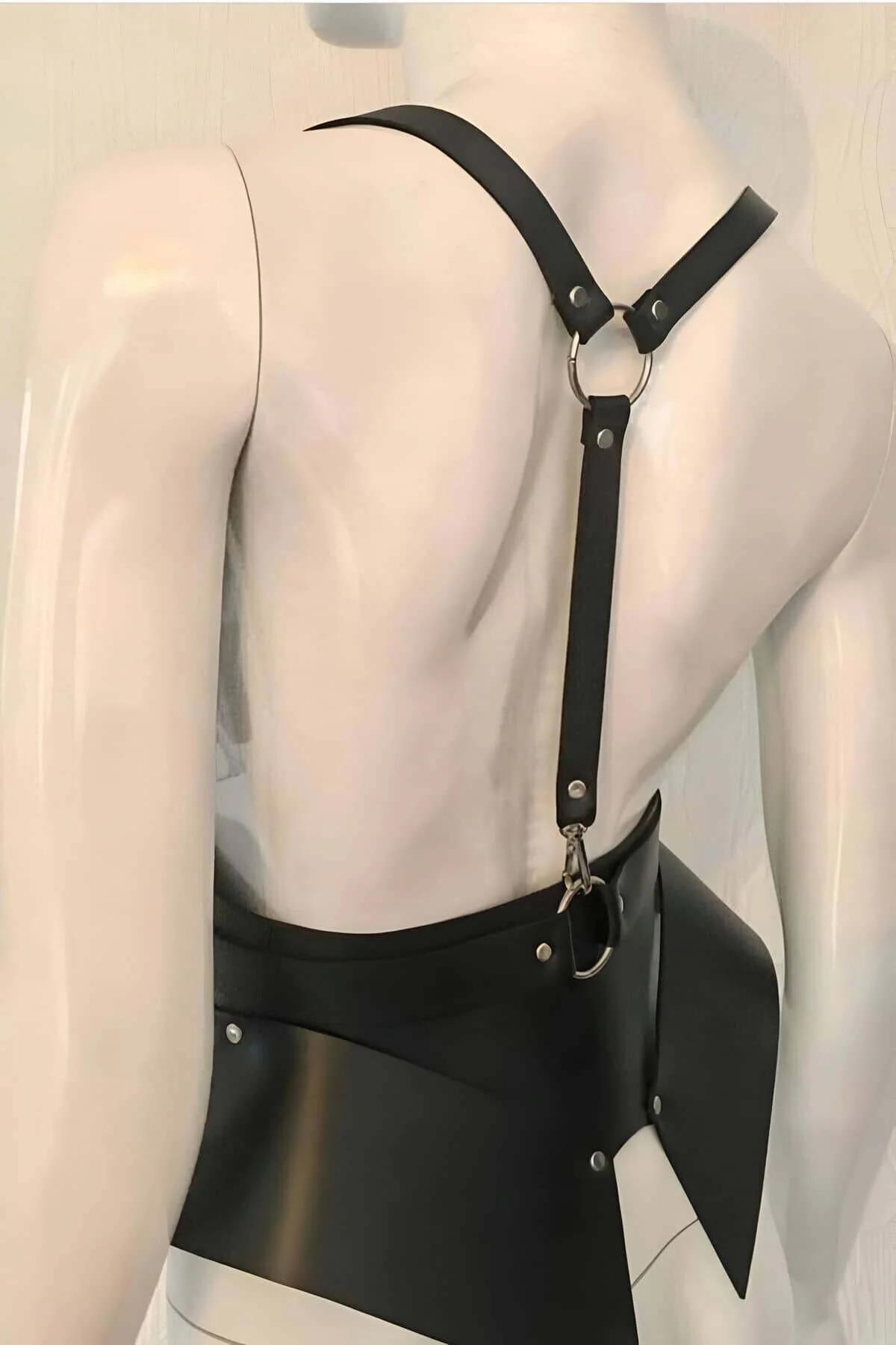 Matte black PU harness showing asymmetric flared waist panel detail and riveted O-ring attachment