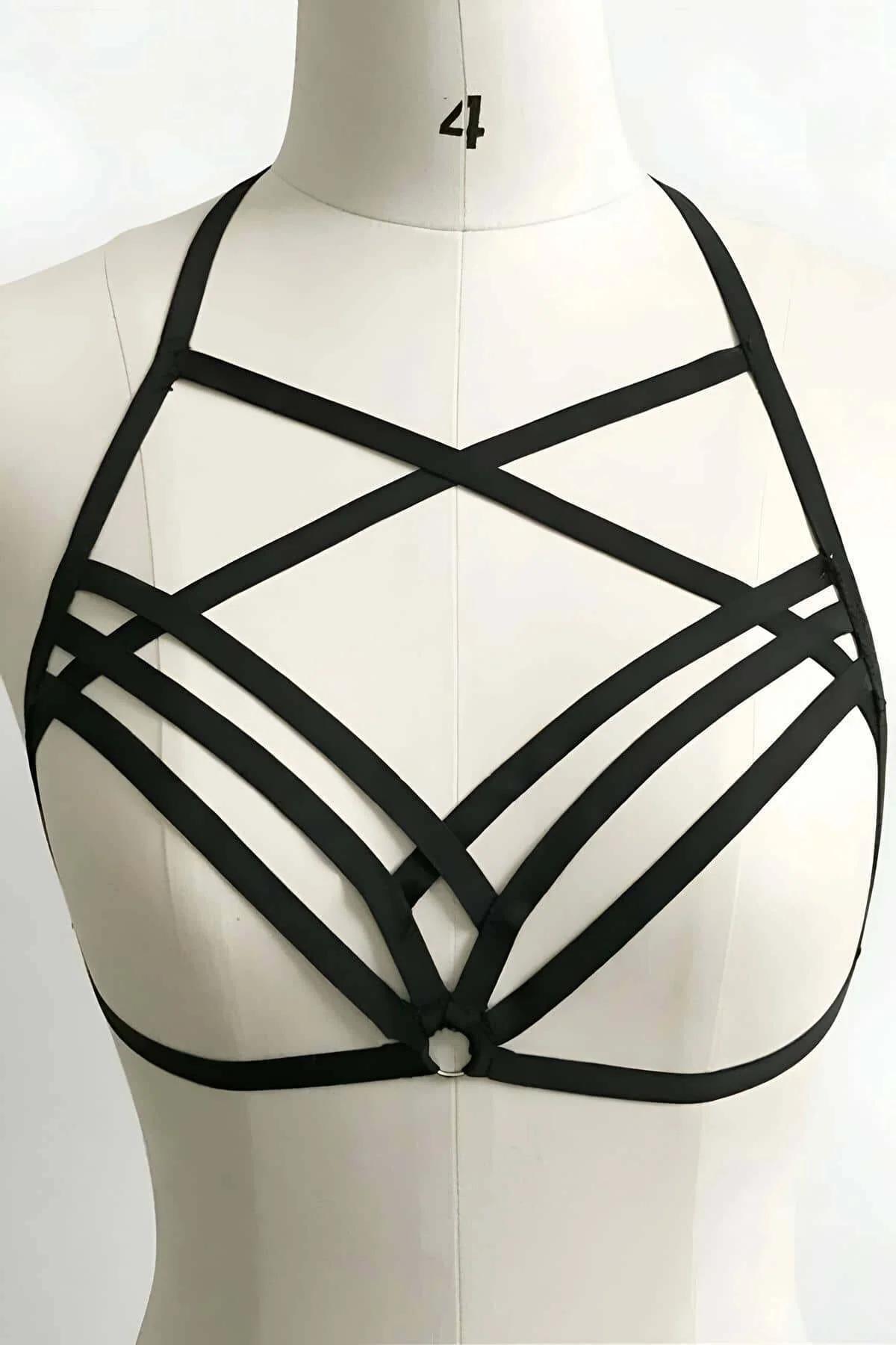 black strappy chest harness flat lay showing criss-cross strap configuration without hardware