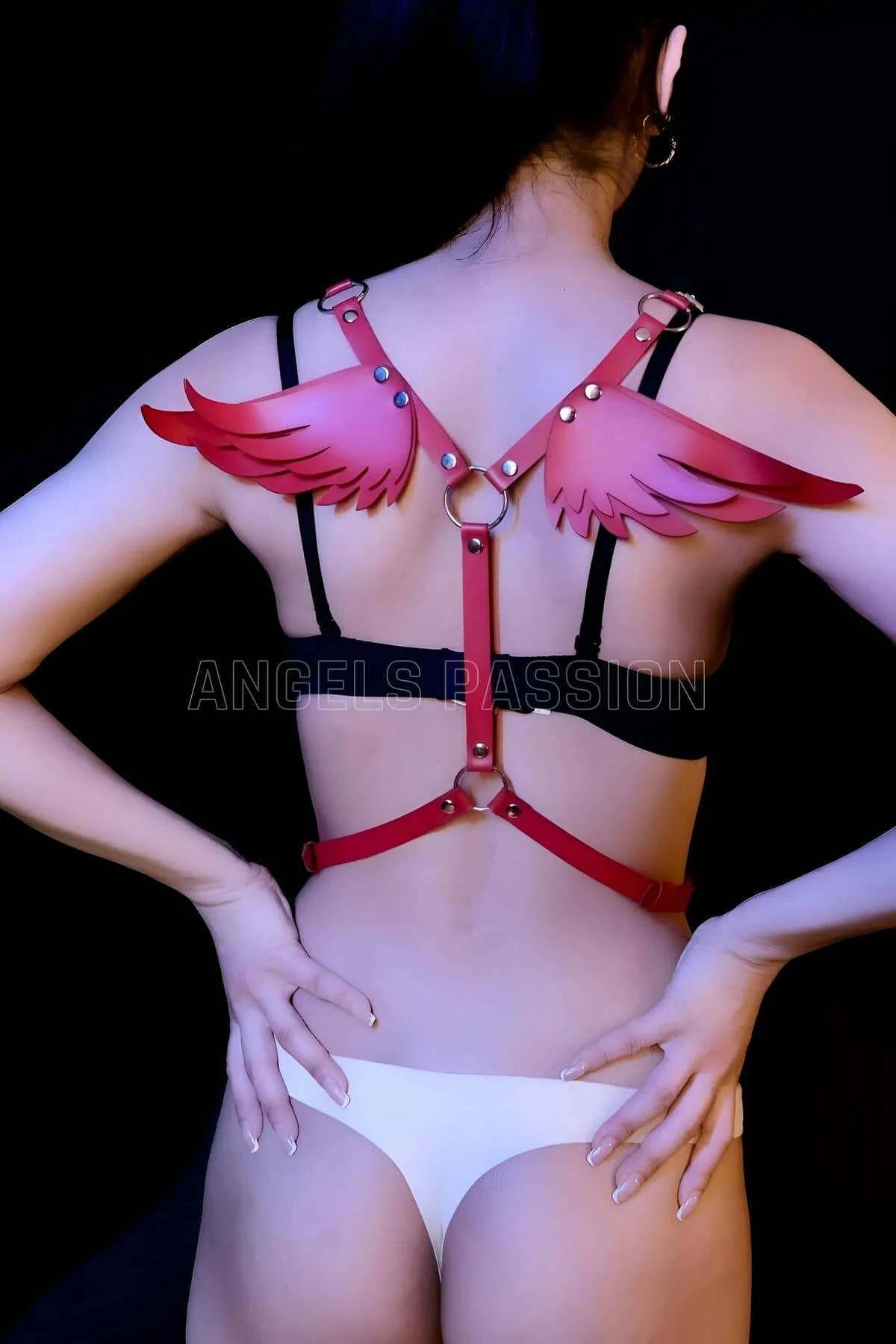 Full back view of red angel wing harness with vertical strap running from neck to waist ring
