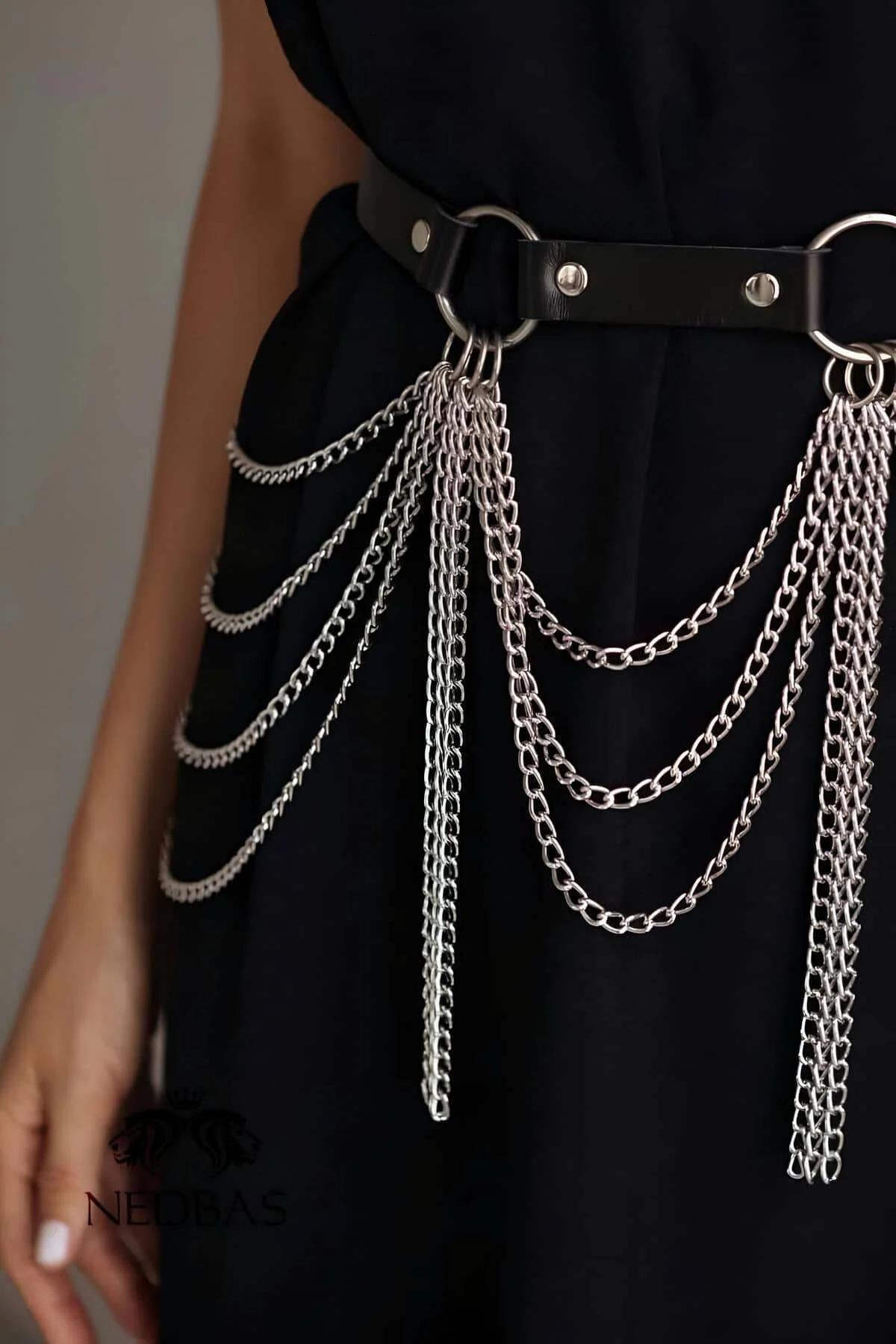 Chain belt harness worn over black maxi dress showing full silver strand drape length