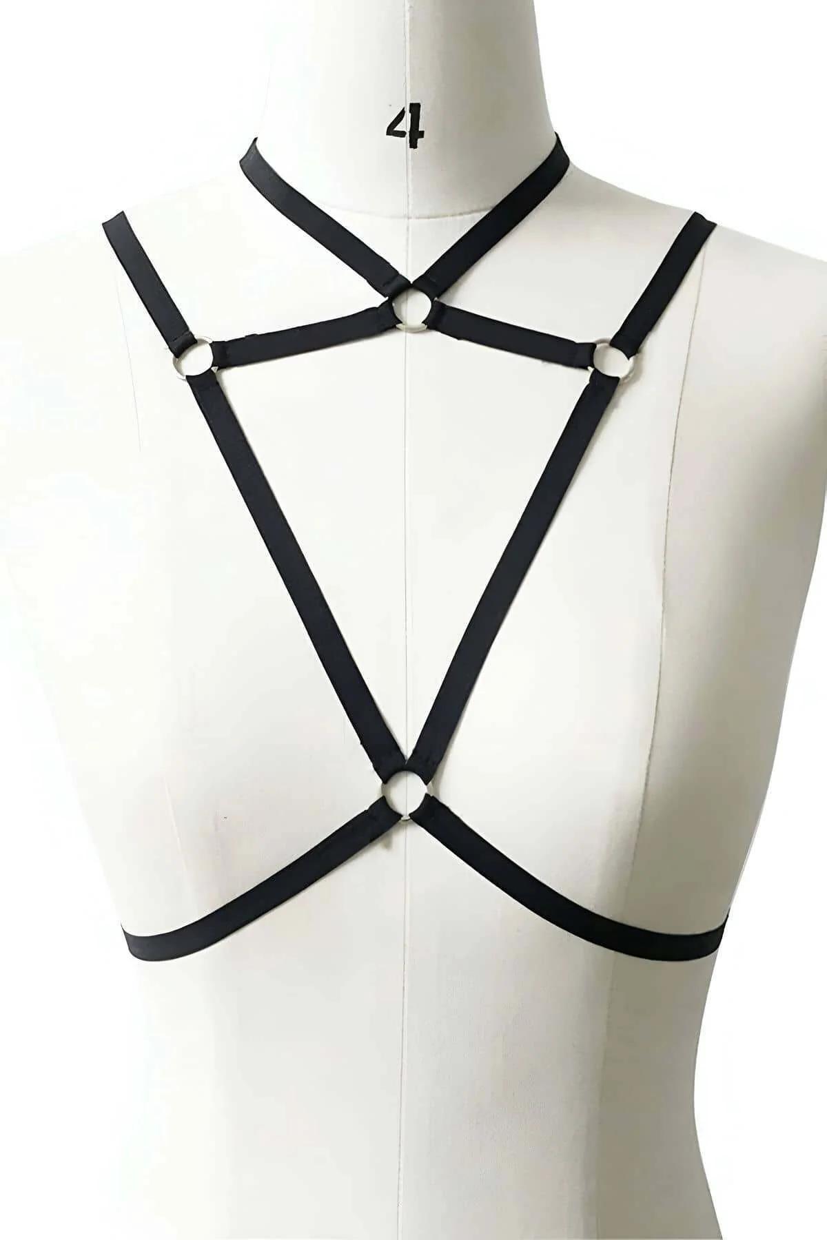 Close-up of silver-tone O-ring hardware on black elastic chest harness choker collar