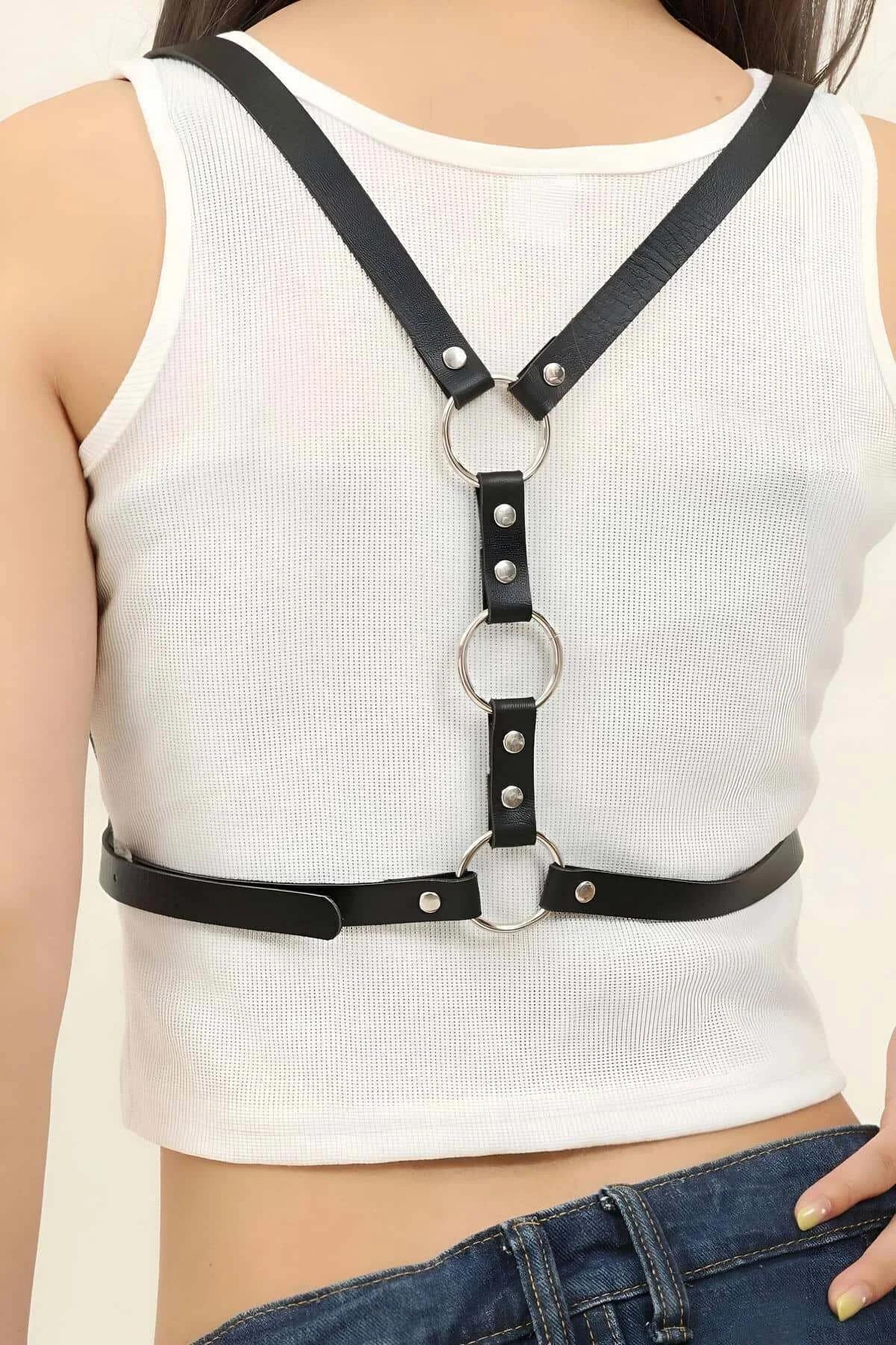 Close-up of silver-tone rectangular pin buckle on black faux leather waist band