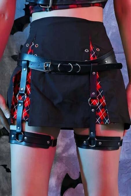 Close-up of silver D-ring buckle closure on black PU leather waist garter harness strap