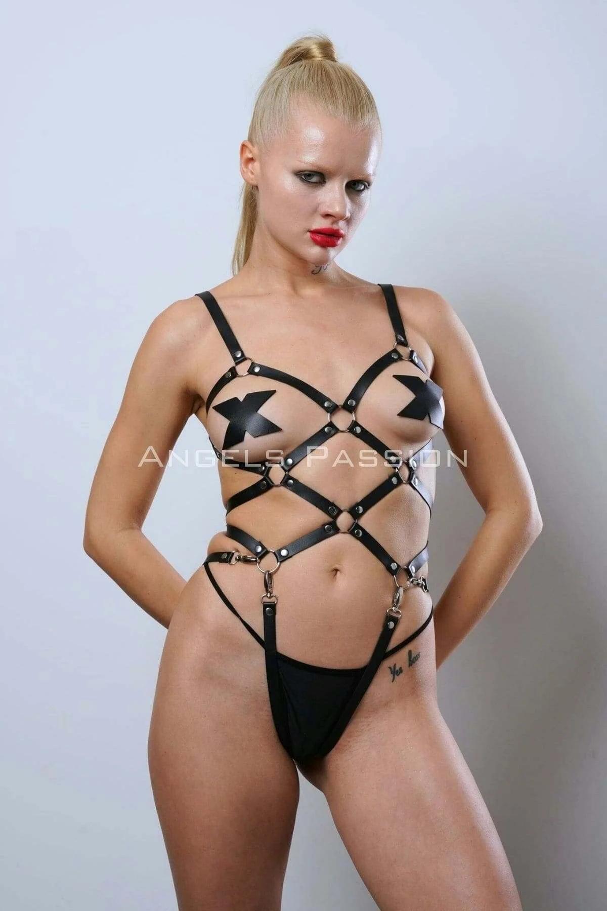 close-up of silver O-ring junctions on black faux leather body harness straps with stud rivets