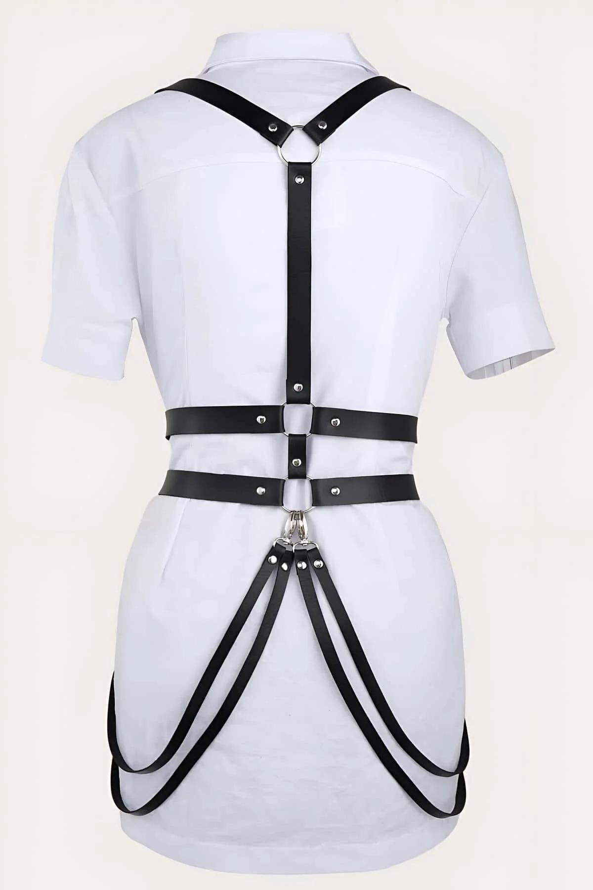 Close-up of silver rectangular buckle on black PU leather waist band with rivet reinforcements