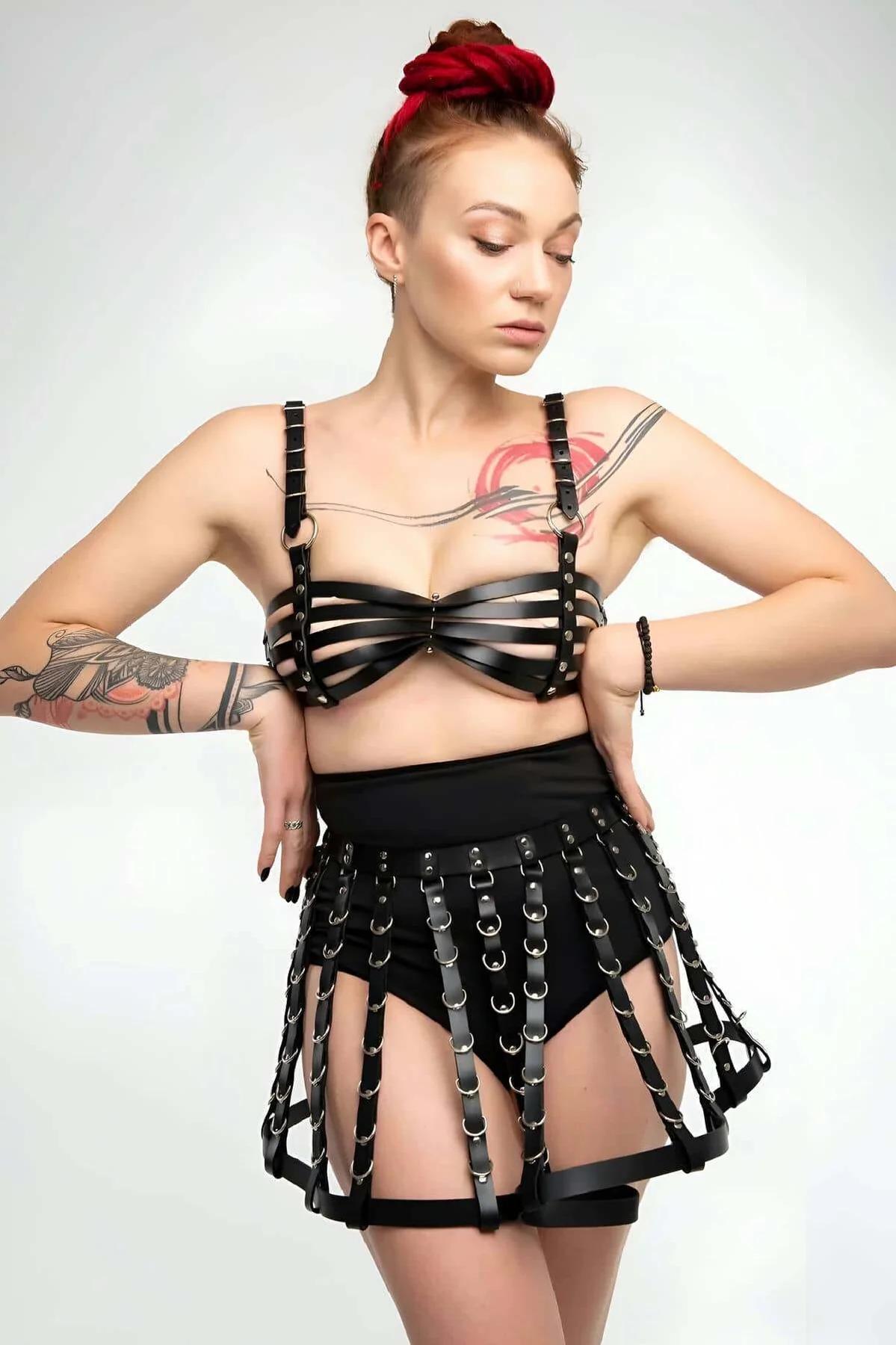 adjustable back slider buckles on black faux leather chest harness detail view