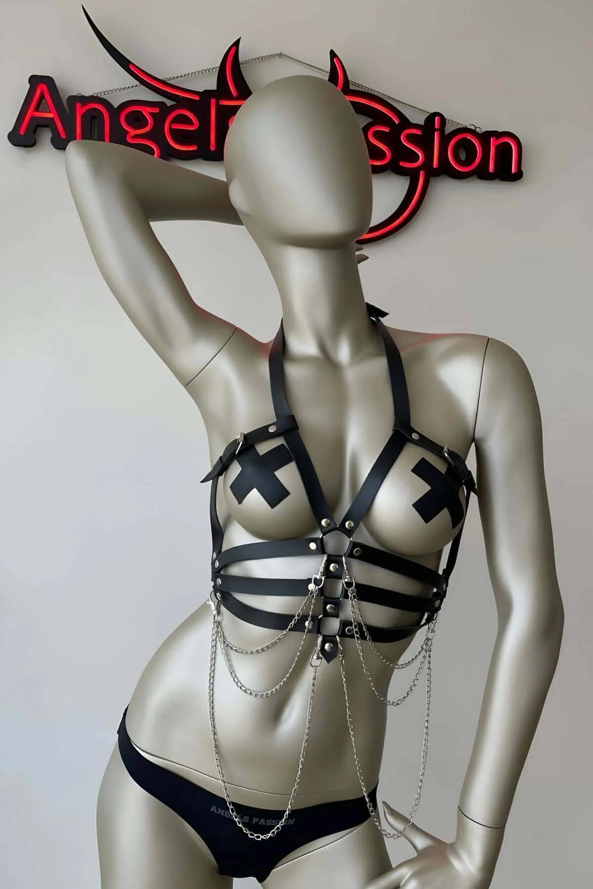 Adjustable halter neck buckle detail on black faux leather chest harness with stud hardware