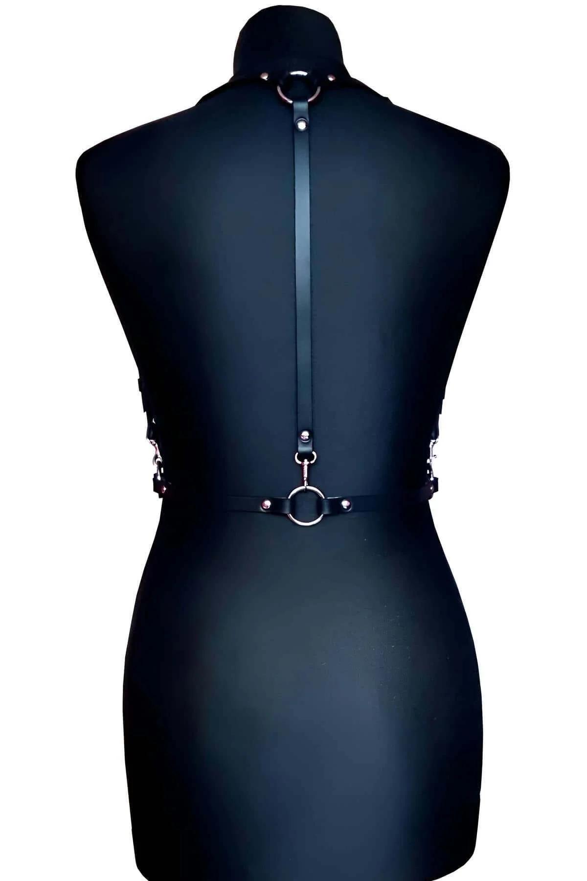 front view of black adjustable chest harness showing five-strap layout and center-front silver buckle closure