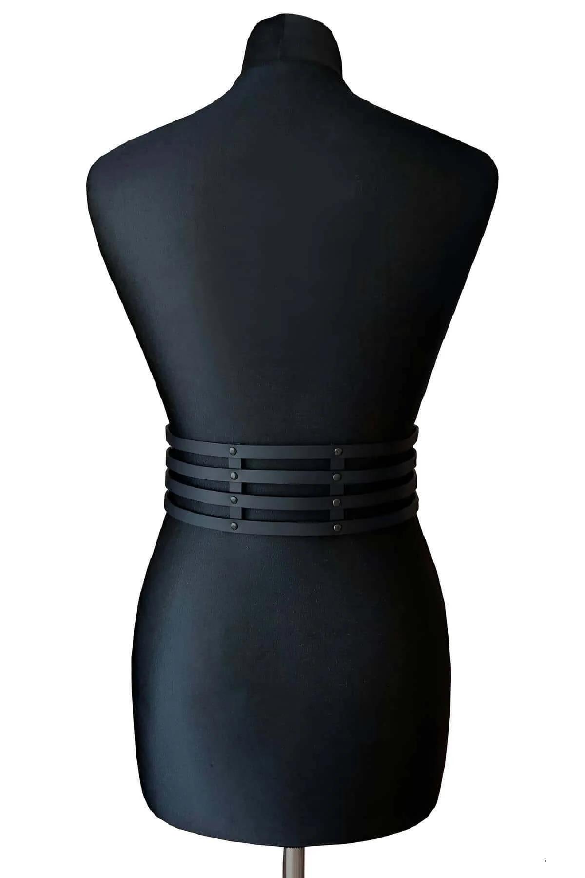 black matte vegan leather waspie belt worn over black outfit showing waist cinching
