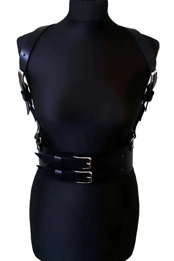 black faux leather strappy body harness belt with dual silver rectangular buckles and adjustable shoulder straps on mannequin