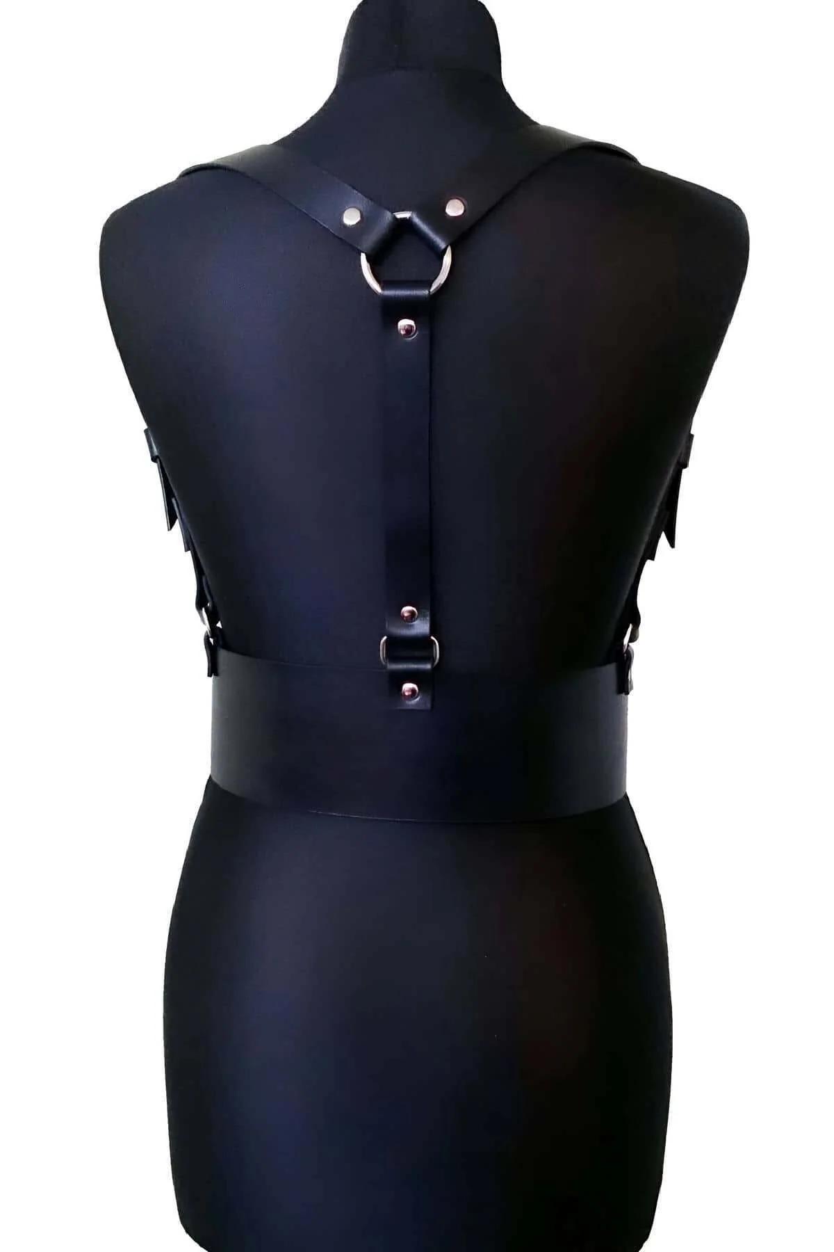 close-up of silver-tone rectangular buckles on black PU leather harness belt waist section