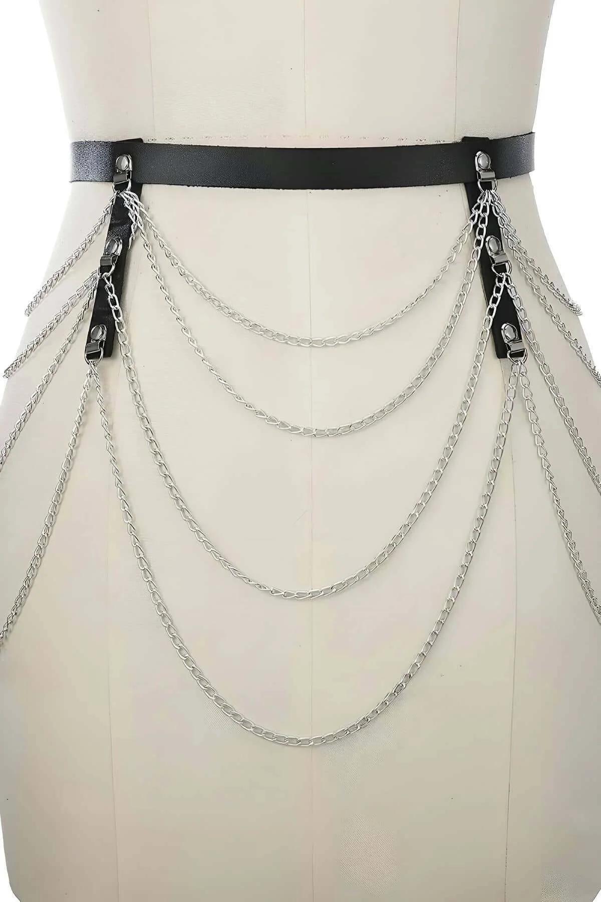 Side angle of black leather chain belt showing layered silver chain drape depth and hip positioning