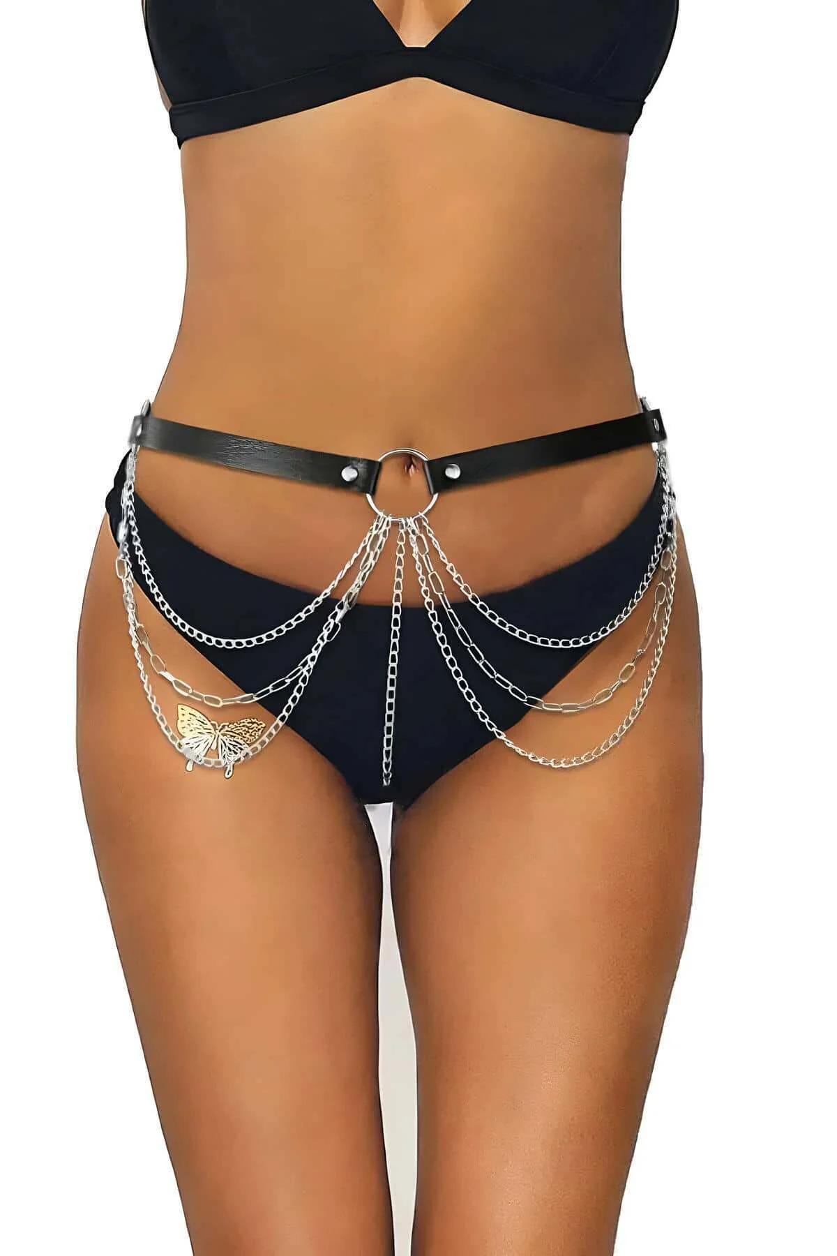 Rear view of black faux leather waist harness pin buckle closure and strap detail