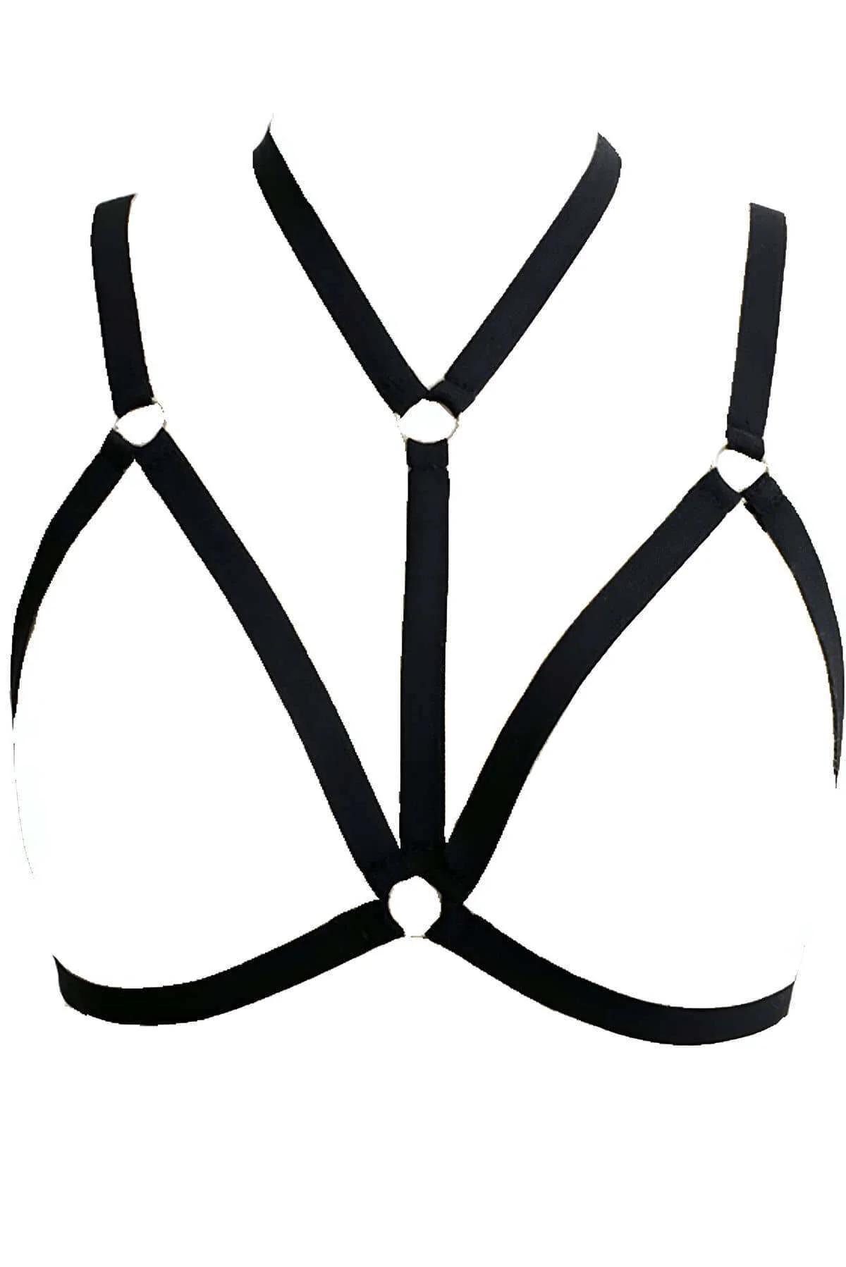 Close-up of gold-tone zinc-alloy O-ring junction on white matte faux leather chest harness
