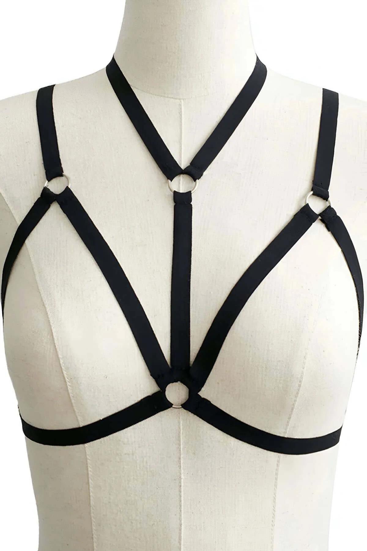 Black strappy chest harness collar band and dual side O-rings detail against skin