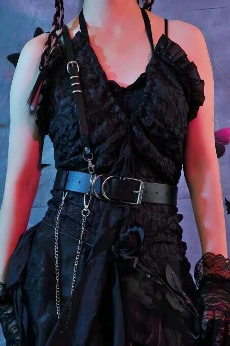 Matte black PU strap diagonal chest harness with silver D-ring and buckle hardware close-up