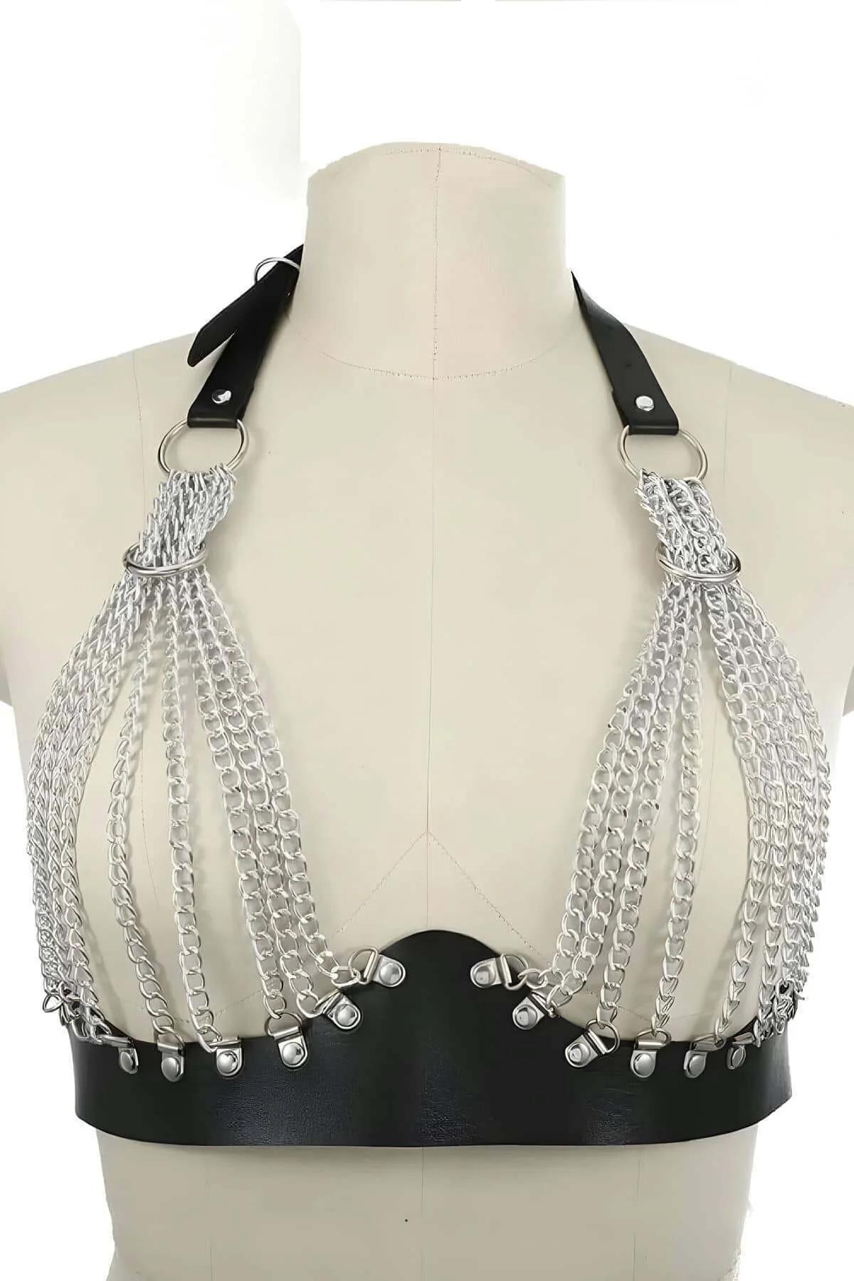 Black faux leather chain harness layered over white button-down shirt full-length view