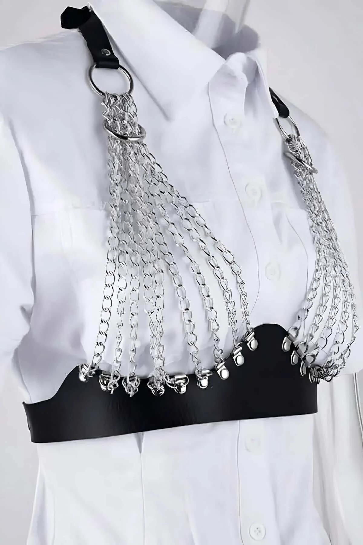 Silver stud detail along lower edge of black faux leather waistband chest harness