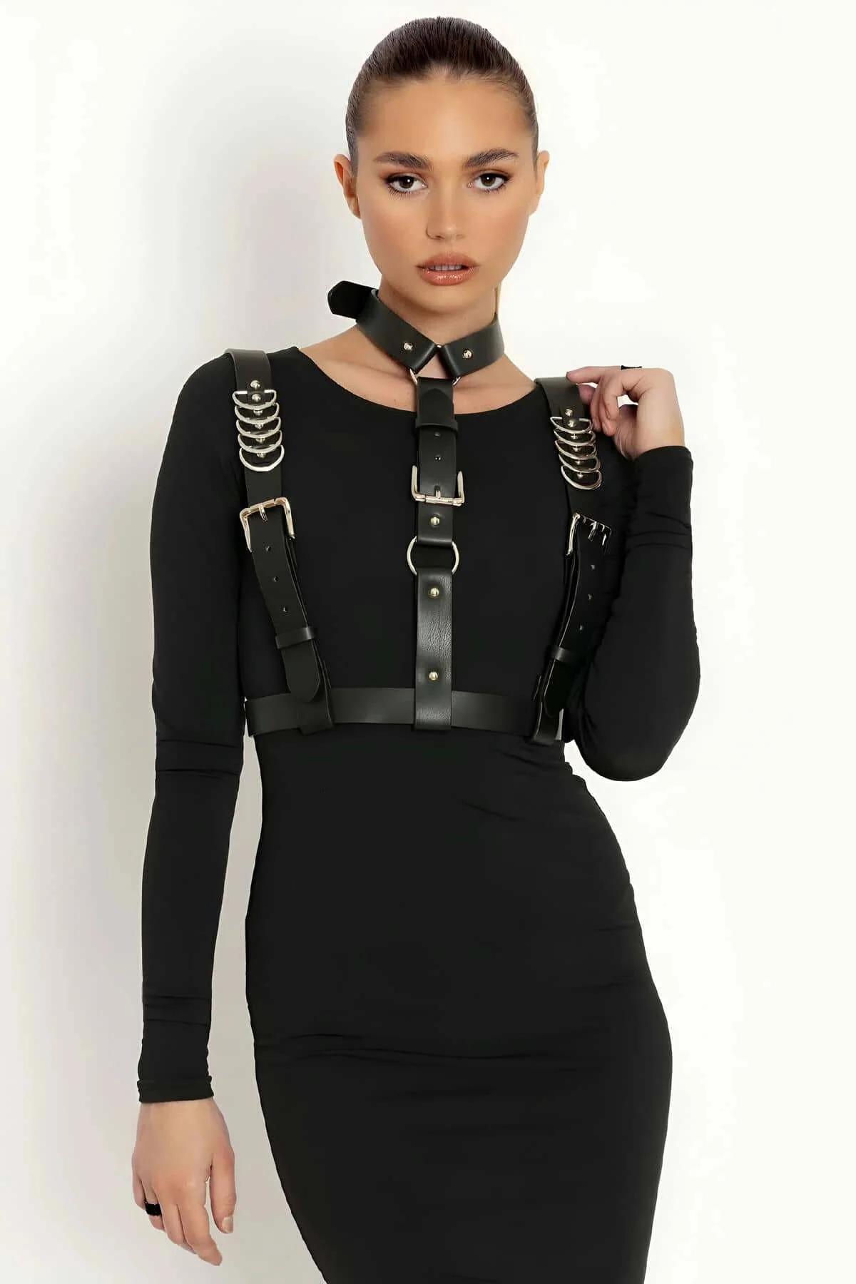 back view adjustable single buckle closure on black faux leather body harness