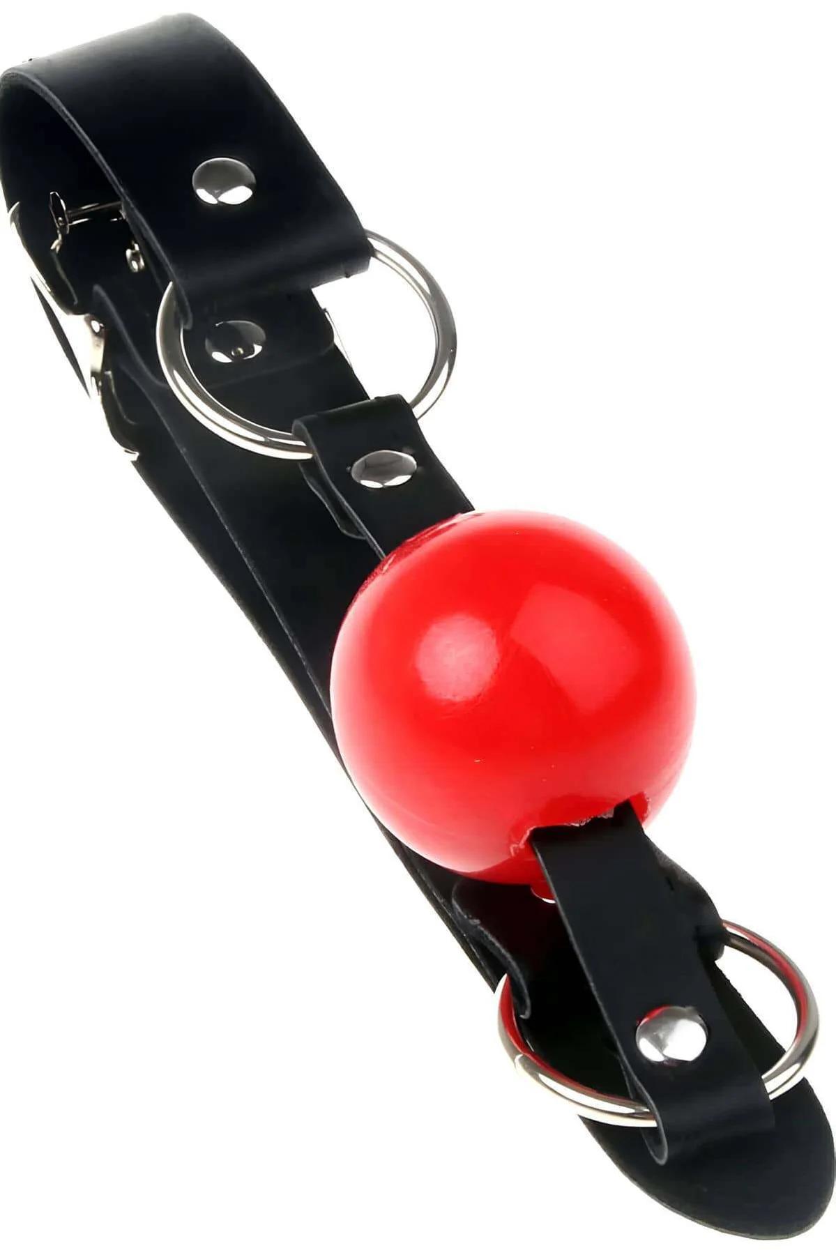 side angle of adjustable black ball gag showing strap width and rear buckle closure