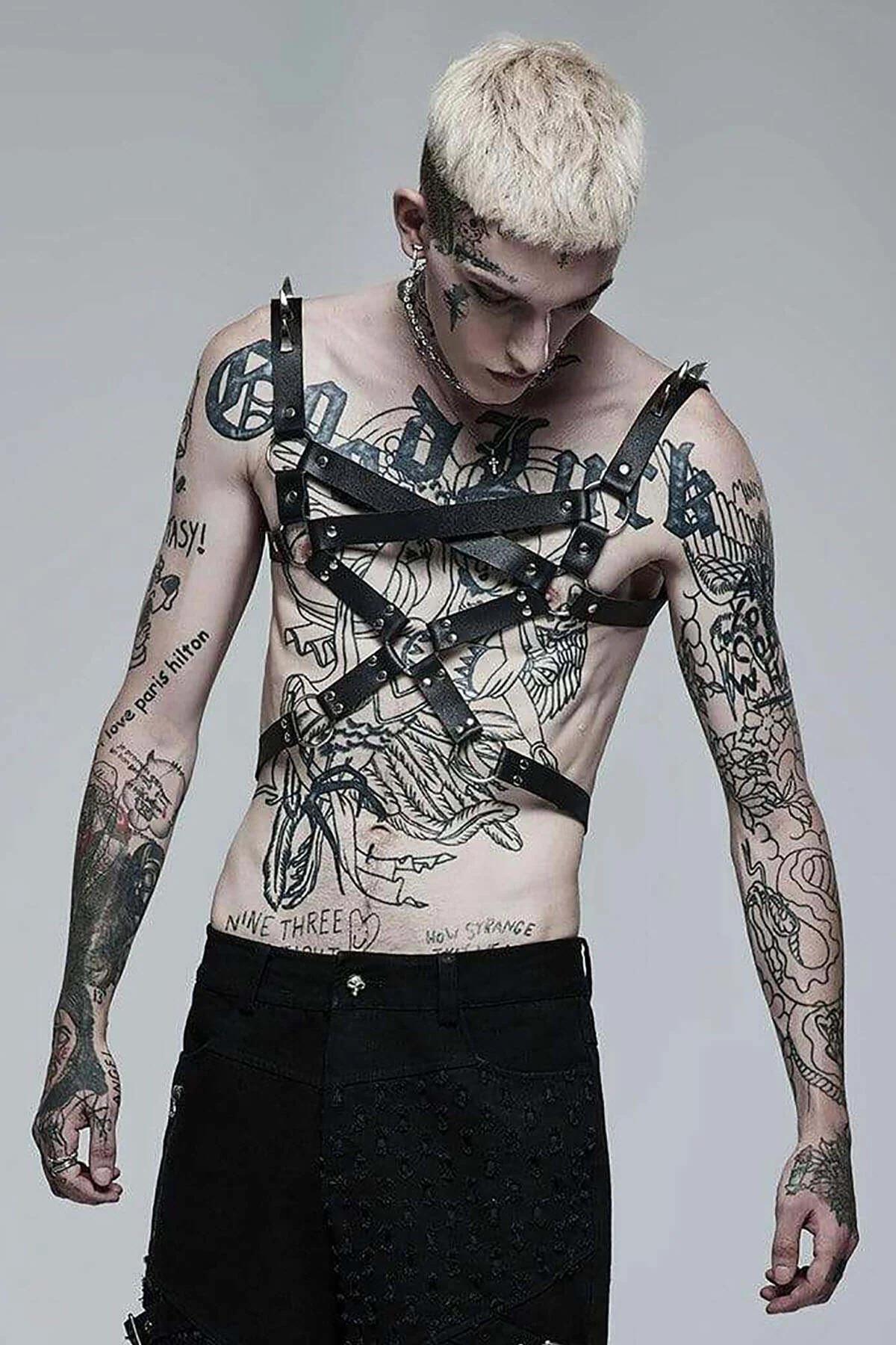 side view of black multi-strap chest harness showing shoulder anchor points and adjustable buckles