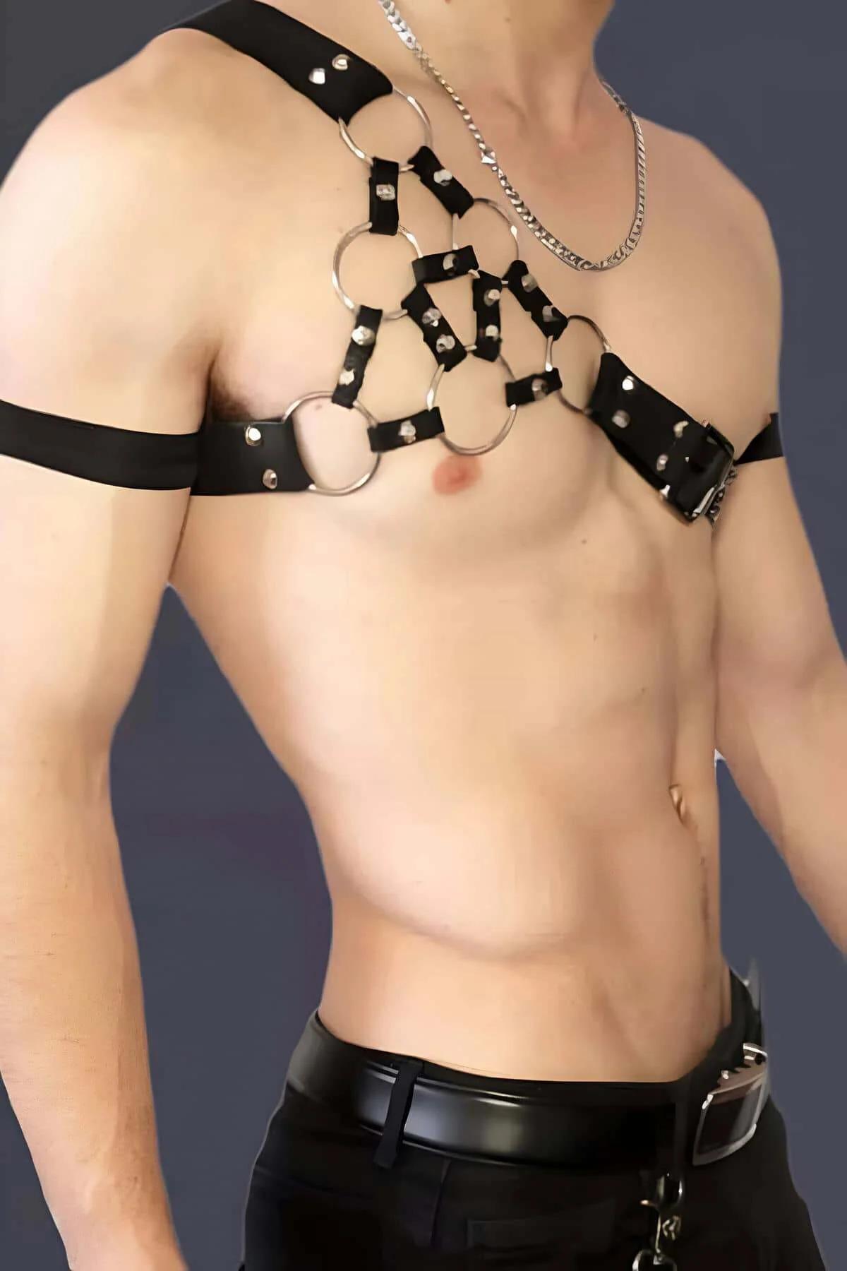 Gold three-row chain panel on black faux leather right chest strap with belt-buckle closure
