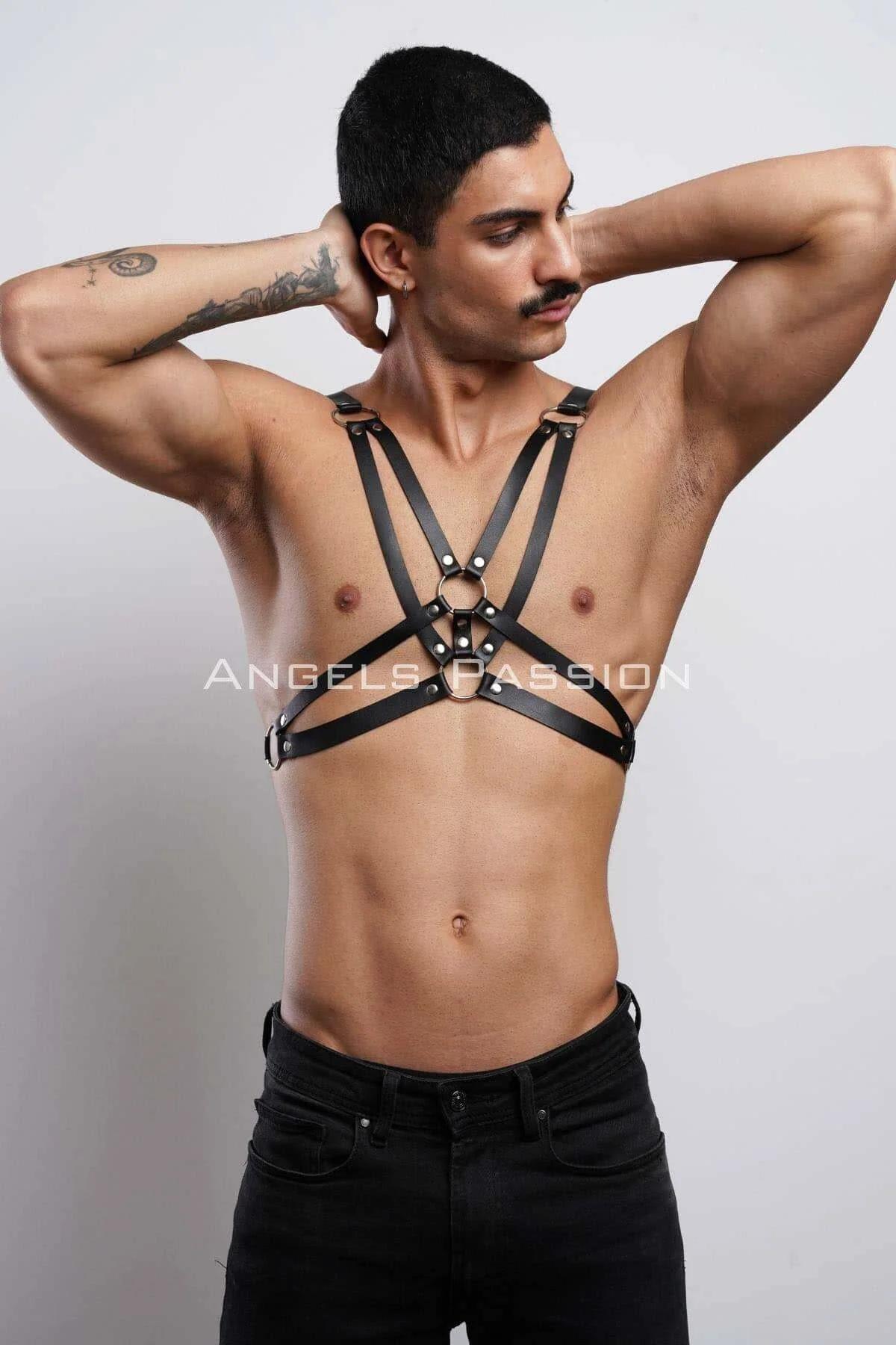 Black geometric chest harness worn over bare skin, V-pattern and horizontal band detail