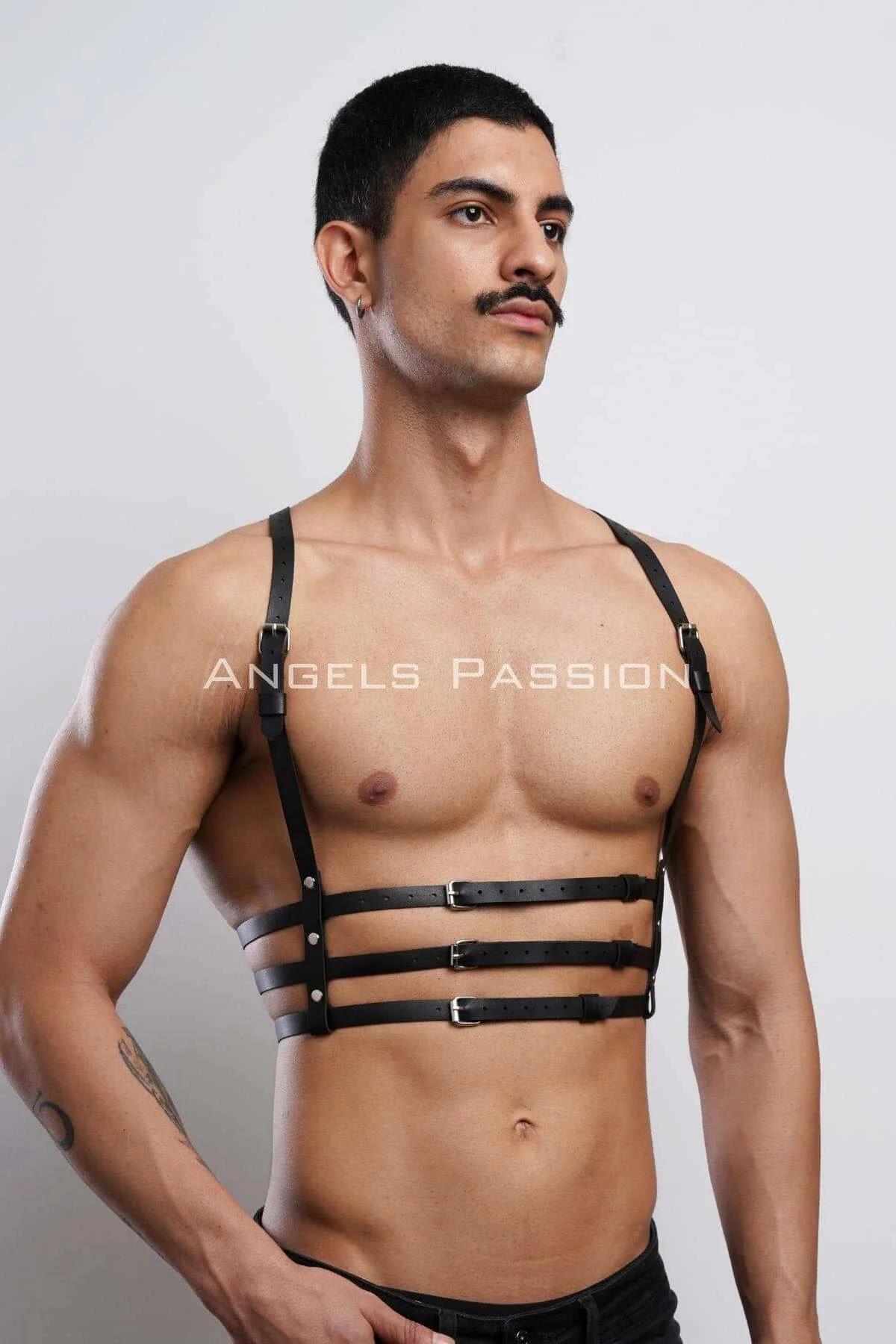 Black multi-band chest harness layered over white tee showing fit and strap width detail