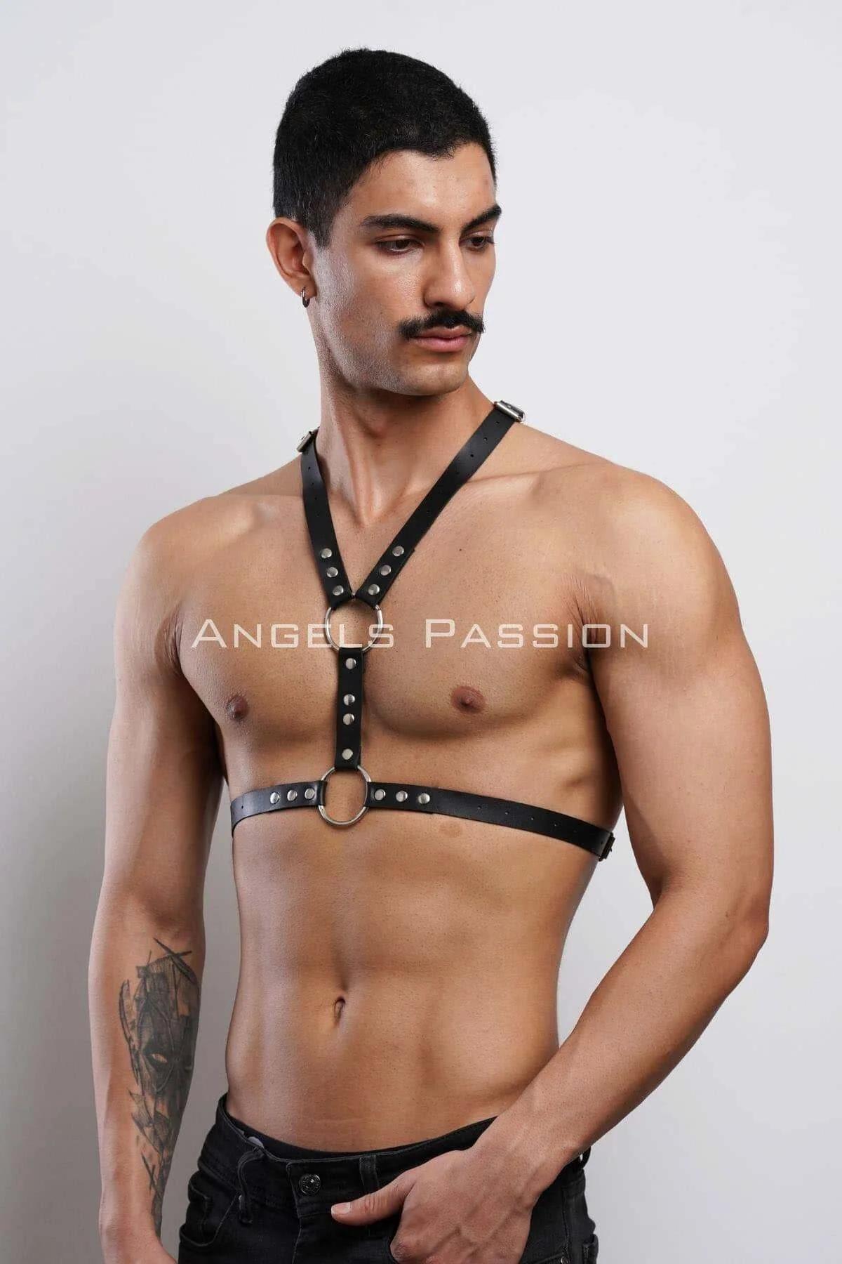 close-up of silver O-ring and rivet detailing on black PU leather chest harness straps