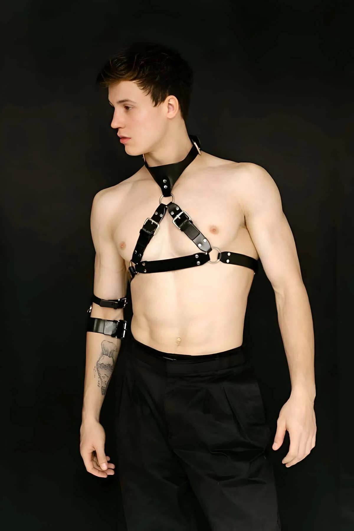 Black faux leather armband with double-bar silver buckle closure, upper arm detail view