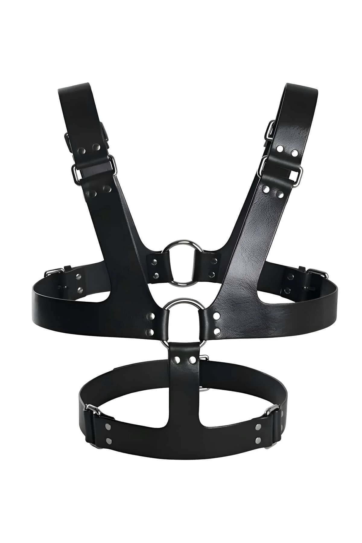 close-up of gold O-ring and stud accents on black faux leather chest harness