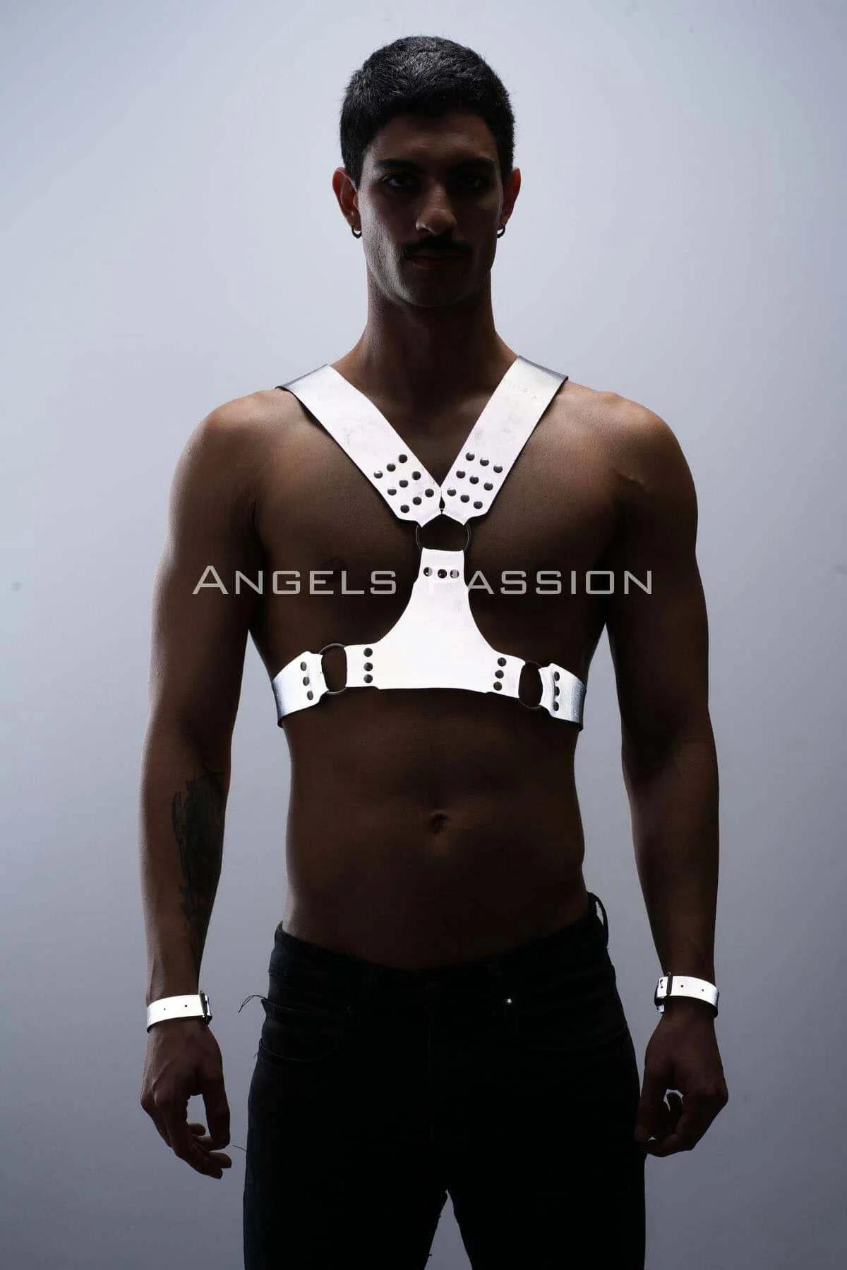 Close-up of white faux leather harness stud clusters and metal buckle side adjustment on waist strap