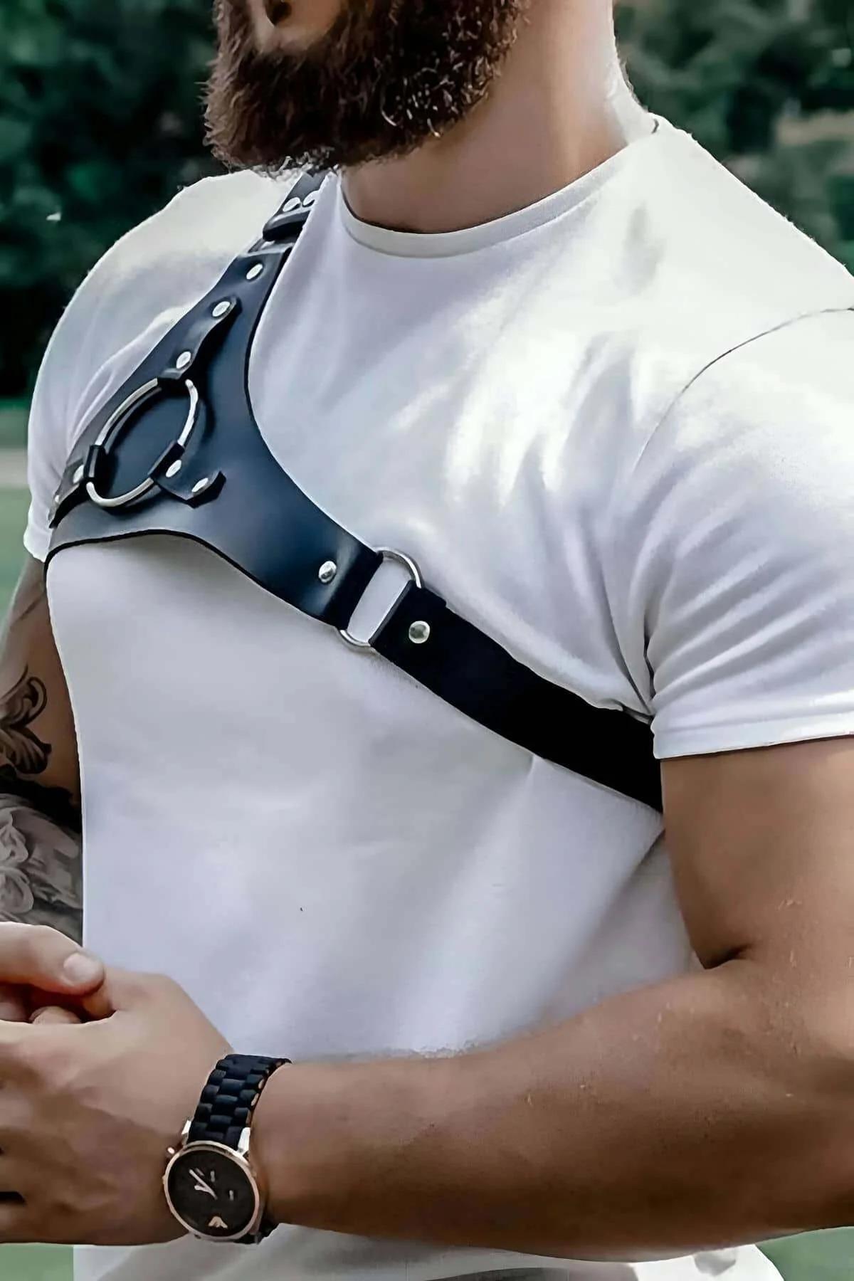 Men black shoulder harness worn over fitted white tee — festival and night-out accessory